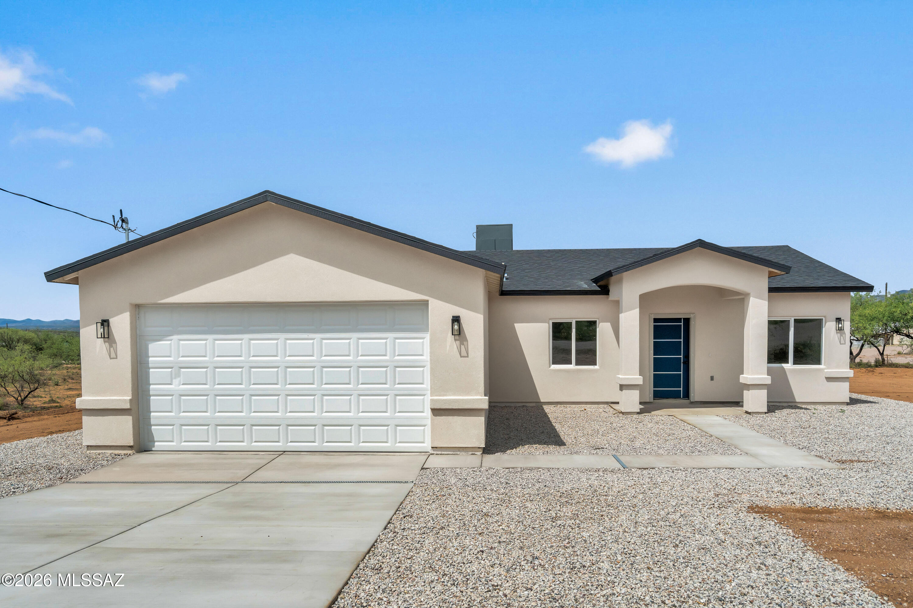 Welcome to your dream home! This stunning, newly constructed 3-bedroom, 2-bathroom residence offers an inviting open layout with vaulted ceilings that create a sense of spaciousness. The modern kitchen is a chef's delight, featuring granite countertops and sleek cabinetry accented with elegant fixtures. Enjoy breathtaking mountain views from the comfort of your living room or the serene backyard.