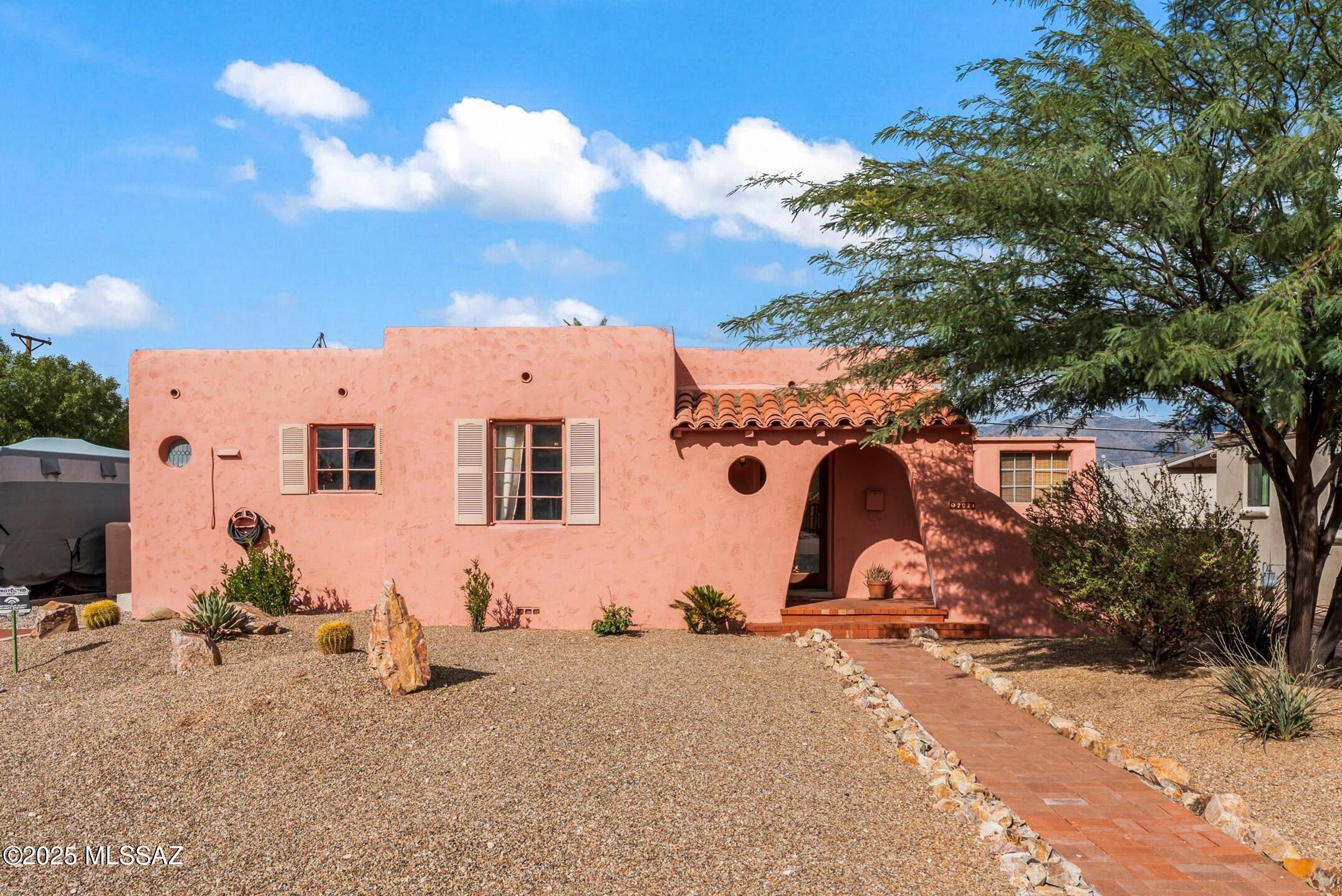Welcome to 2921 E Lester St--an iconic 2000 sq ft Blenman Elm gem blending classic Tucson Spanish charm with modern versatility. This 3 bed, 2 bath home features warm Saltillo tile, a cozy kiva fireplace, and colorful Mexican tile throughout. The backyard feels like a private retreat with a sparkling pool and lush, mature landscape. Currently a successful Airbnb, this property offers endless potential as a primary residence, rental, or winter retreat. Located in the heart of Tucson, you're moments from local bars, restaurants, and just 1.5 miles to the University of Arizona. A rare find in one of Tucson's most beloved historic neighborhoods.