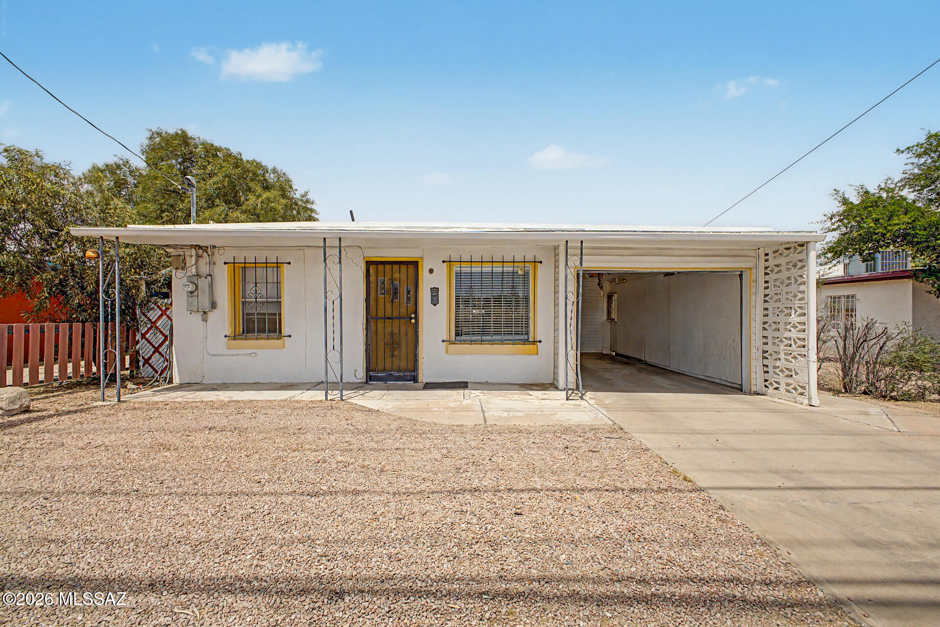 INVESTOR OPPORTUNITY! Charming 2 Bed/1 Bath Single Level Home with Spacious Kitchen & Dining Room, 1 Car Garage, Multiple Storage Sheds (One with a Workbench) & Beautiful Mountain Views from the Spacious Backyard. Large Arizona Room Can Be Converted to 3rd Bed & Bath. AC Only 3 Years Old. Roof Regularly Maintained. Plumbing Upgraded to PVC in 2010. Located in Prime Central Area Close to Tucson Medical Center, University, Whole Foods, & Restaurants. No HOA! Priced As-Is & Ready for Full Remod!