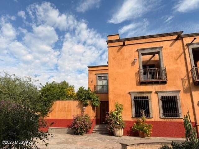 Gorgeous Spanish Colonial Corner Home on the East Plaza of the Mercado District. This is a striking masonry home with Imperial Plaster Interior, Old Beamed Ceilings, Stone Paved Private Entry Courtyard with a Fountain, Interior Courtyard, Antique Wooden Doors to the Community Plaza, Indoor/Outdoor Space Upstairs and Downstairs, Lush Vegetation, Polished & Stained Concrete Floors, A Traditional Mexican Kitchen with Antique Teak Countertops, and is truly a show-stopper. Wonderful home with so much character, interesting spaces, great views and located within a very active and dynamic neighborhood. Lots of restaurants & coffee shops, retail to walk to & hop onto the Streetcar any time. It's a real urban environment. Newer HVAC, Hot Water Heater, Roof, Disposal, Refrig,, Dishwasher. Hurry. This classic home won't last long.  The cost to build this home in the Mercado will run $100s of thousands more.  Save money & buy resale.  New LG Refrigerator, New LG Dishwasher, Newer HVAC(2024 or 2025), Hot Water Heater from 2022-23, Roof Just Redone by B & M Roofing. 
100 mile Bike path is walking distance away.  Like to hike? Walk to A-mountain or Tumamoc Hill.  Hike the West side mountain trails. 
Extremely close to Downtown, YMCA, library, the University of Arizona, Mission Gardens, Safeway and Saint Mary's hospital.