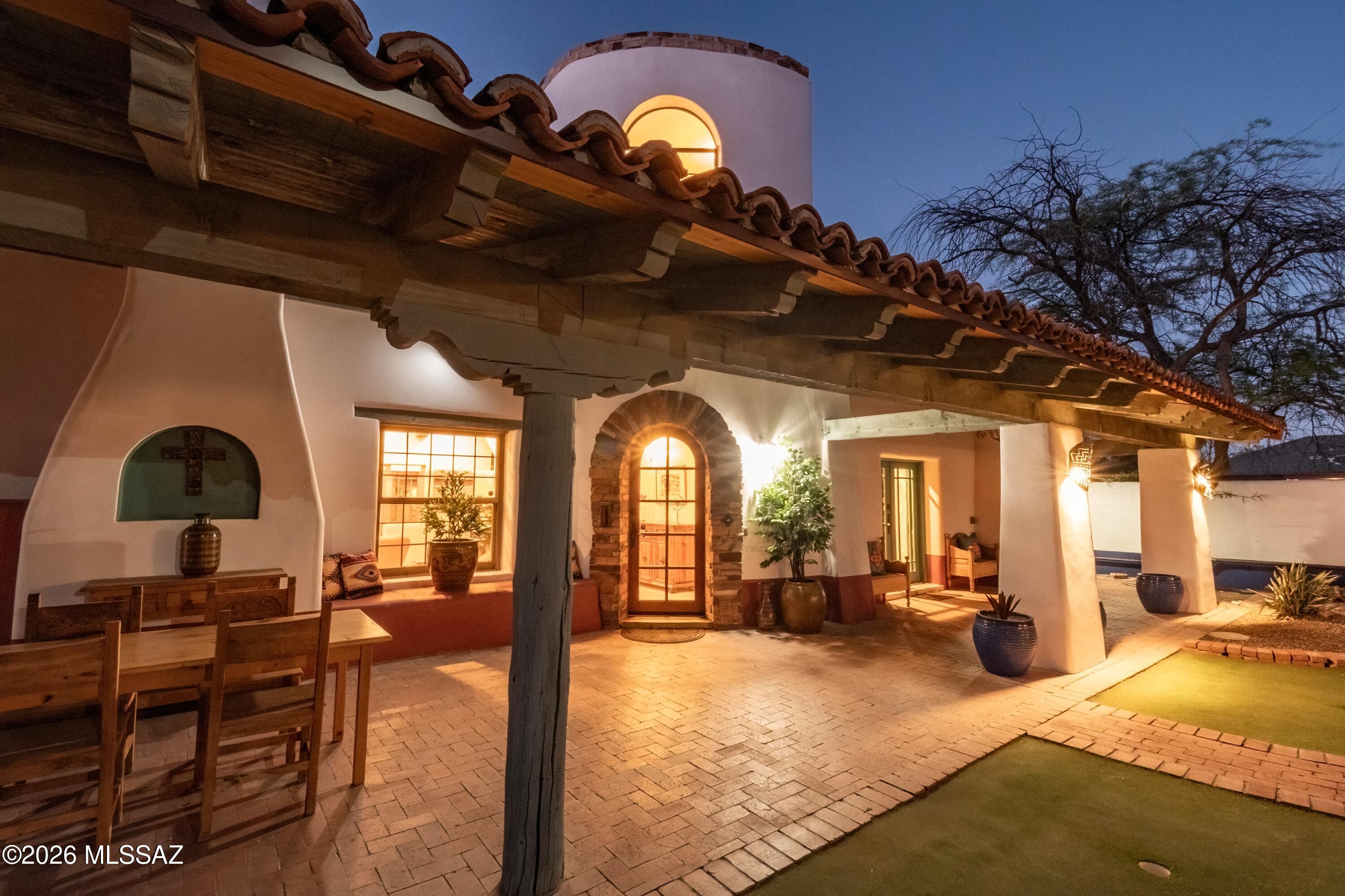 Looking for a  beautiful home in Sam Hughes for a fraction of the cost? Look just a few blocks North in the Jefferson Park Historic neighborhood. Located on the walking and  bike trail to the UofA. Close proximity to Downtown/Midtown, Banner Hospital, Restaurants, Performance and Sport Venues, Shopping, Historic Neighborhoods, Parks and Museums.  3 homes, not just 1! Impeccably updated main home with 3047 sq ft featuring 2 Primary Suites and 1 Guest.  Two additional guest houses with full kitchen and bath. The property is gated and move in ready for the professional looking for a Tucson home with endless living and entertainment possibilities. Amazing opportunity for multi gen living or investment income.  This property is special and offers so much as a family compound or rental, or both. The interior of the main home is designed to offer spacious living and entertainment areas, including a large Open Concept kitchen with dining. The architecture is unmatched with Southwest Beams and Modern finishes. 4 covered parking spots. If you are looking for a place to share with family or a long term investment, you get both!