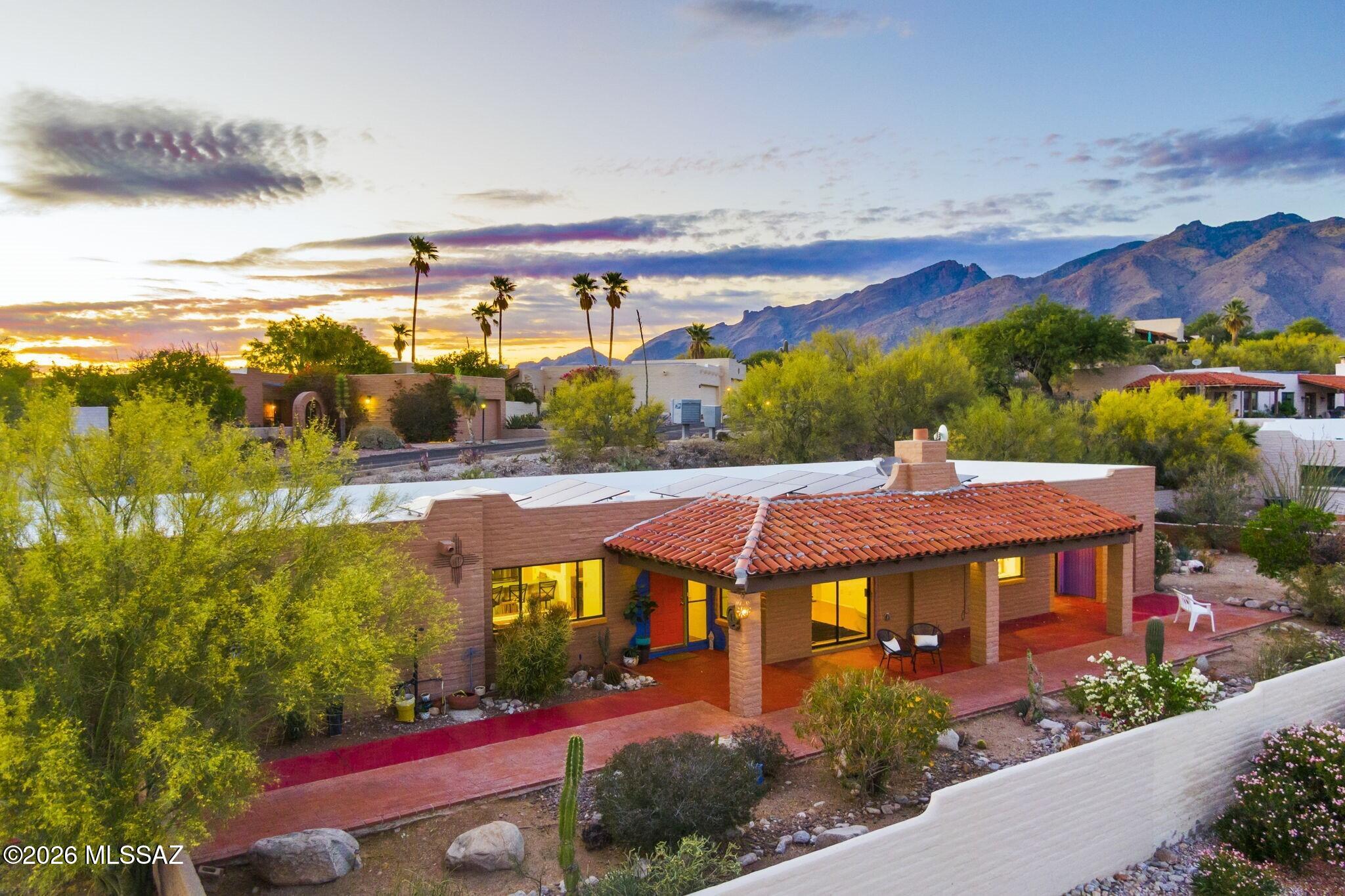 Perched on a private .25-acre ridgetop homesite, this detached Fairfield townhome is ideally situated within the sought-after Sunrise Presidio community, offering a blend of privacy, quality construction, and breathtaking surroundings. From this elevated vantage point, the home captures sweeping, unobstructed views of the Catalina Foothills, Rincon Mountains, and Santa Rita Mountains, complemented by sparkling city lights that come alive at sunset. Built with classic Territorial masonry construction, the residence reflects the timeless craftsmanship and thoughtful design Fairfield Homes is known for. Outdoor living is a true highlight, with an expansive covered patio perfectly oriented to the east that is ideal for enjoying peaceful sunrises, shaded afternoons, and vibrant desert skies. Inside, the home offers a warm and inviting atmosphere with solid surface flooring throughout, a charming beehive gas fireplace, and abundant natural light enhanced by skylights. Freshly painted and move-in ready.
The kitchen is both functional and welcoming, opening to a casual dining nook and featuring a spacious walk-in pantry and a breakfast bar.
Designed for ease of living, the property includes fully owned solar for energy efficiency and a new roof installed in 2025 providing both peace of mind and long-term value. Whether you're seeking a full-time residence or a low-maintenance lock-and-leave retreat, this home delivers the best of foothills living in a premier Fairfield enclave.
The community includes a heated community pool, tennis & pickleball courts, and walking trails. HOA provides Garbage and recycling collection. Convenient to Bashas, Whole Foods grocery, top restaurants, top-rated schools, hiking trails, and convenient amenities, this townhome offers an exceptional opportunity to enjoy the best of Foothills living.