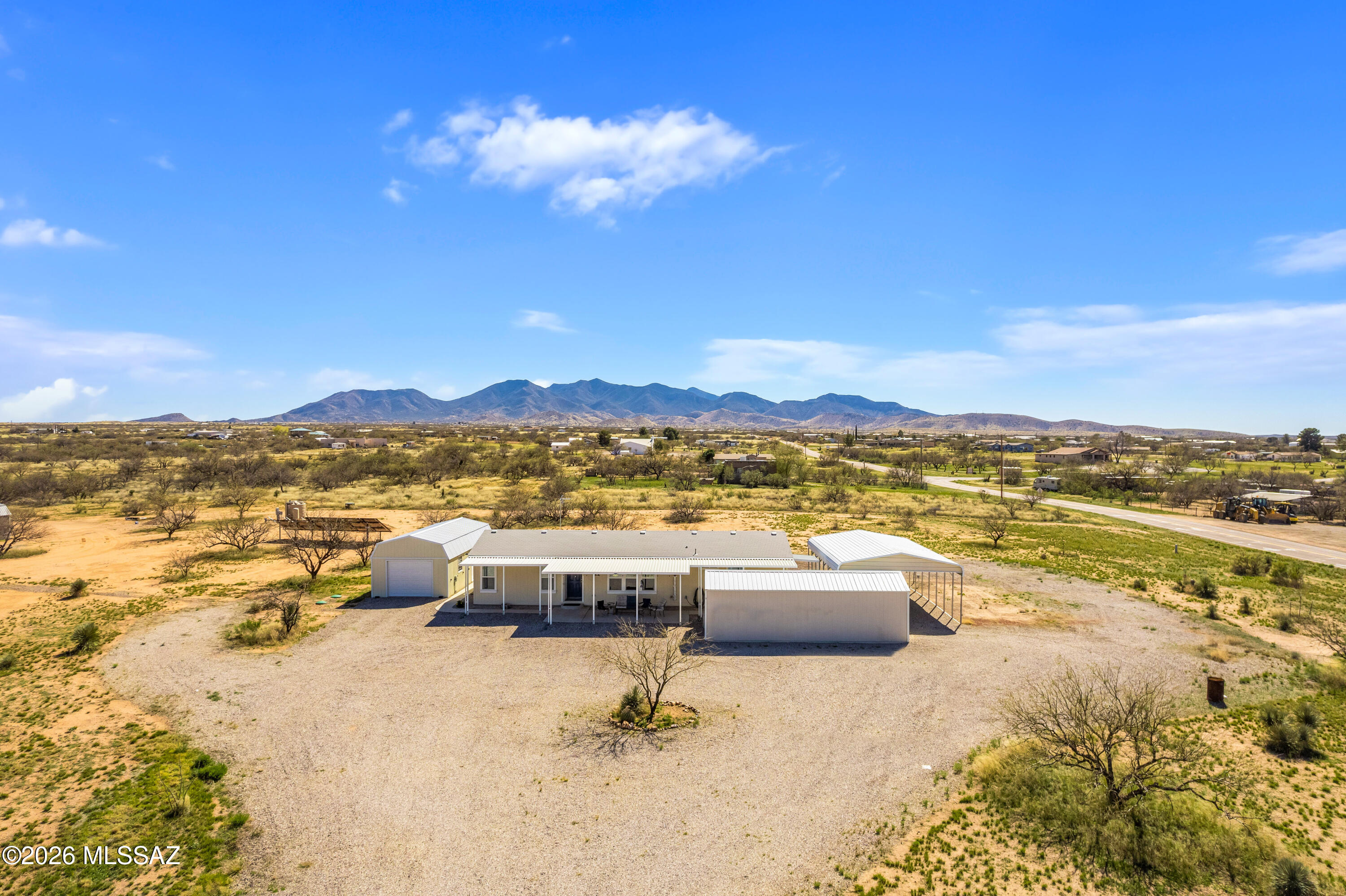 Built in 2020, this beautiful manufactured home sits on just over 4 acres with stunning panoramic and mountain views. The open floor plan offers bright, comfortable living with modern finishes throughout. A detached workshop and garage provide plenty of space for projects and storage. The massive solar system powers both the home and private well, offering energy efficiency and lower utility costs. Enjoy privacy, wide-open space, and incredible Arizona skies in this move-in ready retreat. Grid down, don't frown! This home has (2) separate solar systems installed. System 1 is a Nature's Generator Powerhouse Hybrid Platinum System. Charged by (8) 410 watt solar panels. System 1 is dedicated to the well equipment. System (2) is dedicated to powering the homes power needs. System 2 is a Nature's Generator Powerhouse Hybrid Platinum  Charged by (8) 410 watt solar panels. Bought and paid for by the current owner, This emergency backup system was installed by Antelope Run Electric, and permitted at Cochise county, Conveys with home.