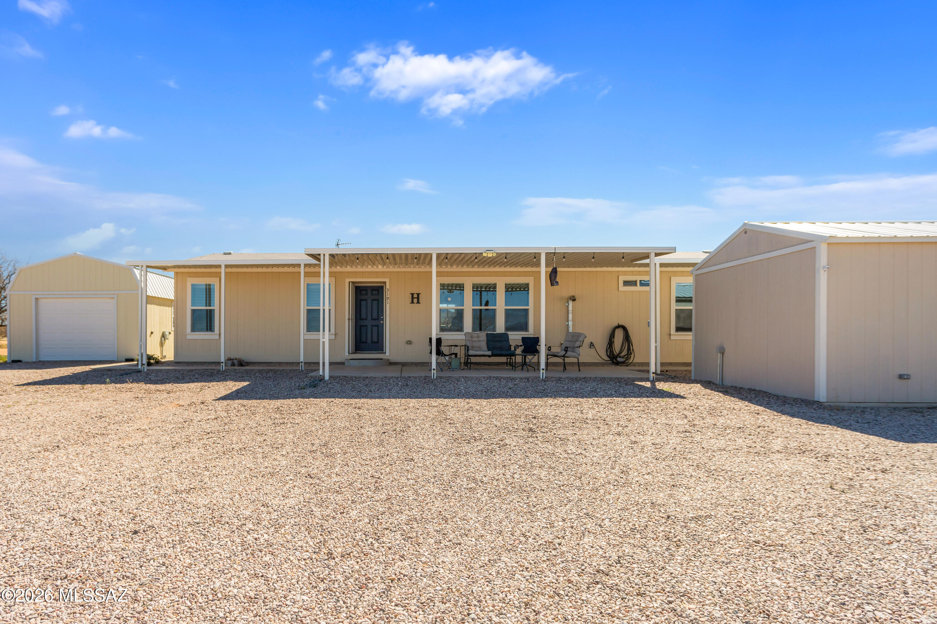 Built in 2020, this beautiful manufactured home sits on just over 4 acres with stunning panoramic and mountain views. The open floor plan offers bright, comfortable living with modern finishes throughout. A detached workshop and garage provide plenty of space for projects and storage. The massive solar system powers both the home and private well, offering energy efficiency and lower utility costs. Enjoy privacy, wide-open space, and incredible Arizona skies in this move-in ready retreat. Grid down, don't frown! This home has (2) separate solar systems installed. System 1 is a Nature's Generator Powerhouse Hybrid Platinum System. Charged by (8) 410 watt solar panels. System 1 is dedicated to the well equipment. System (2) is dedicated to powering the homes power needs. System 2 is a Nature's Generator Powerhouse Hybrid Platinum  Charged by (8) 410 watt solar panels. Bought and paid for by the current owner, This emergency backup system was installed by Antelope Run Electric, and permitted at Cochise county, Conveys with home.
