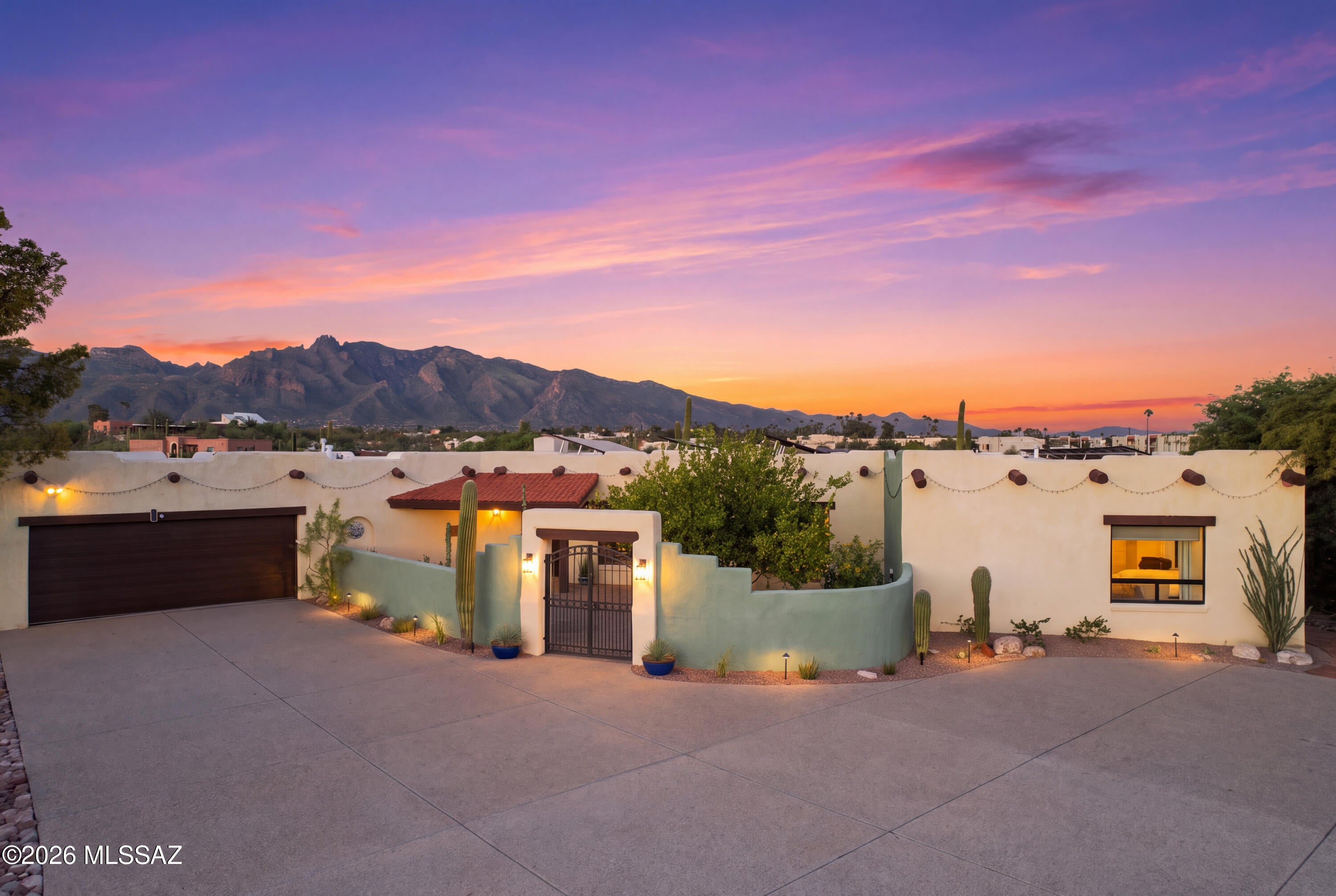 When classic Southwest charm, rich history, and thoughtful modern luxury come together, the result is something truly special. Tucked away in a remarkably private setting, this distinctive Southwest-style residence welcomes you through an inviting courtyard and immediately reveals the character that makes this home one of a kind.
Inside, timeless Saltillo tile, authentic viga beams sourced from the mines of Southern Arizona, and warm architectural details create a sense of place that simply cannot be replicated. All three bedrooms are en suites, each beautifully and extensively updated, offering both privacy and comfort for owners and guests alike.
The heart of the home is the remodeled kitchen, where classic Southwest design meets modern convenience. A charming kiva fireplace anchors th Inside, timeless Saltillo tile, authentic viga beams sourced from the mines of Southern Arizona, and warm architectural details create a sense of place that simply cannot be replicated. All three bedrooms are en suites, each beautifully and extensively updated, offering both privacy and comfort for owners and guests alike.
The heart of the home is the remodeled kitchen, where classic breakfast nook, while updated countertops, upgraded appliances, a professional-grade hood, smart lighting, and a beverage refrigerator make the space equally suited for everyday living and entertaining.
Step outside and the home truly becomes a private desert retreat. New Travertine patios frame the outdoor living spaces, while the saltwater PebbleTec pool, updated Pentair pool and spa equipment, and new hot tub with a cascading waterfall create a resort-like setting surrounded by stunning views. Whether hosting a large gathering or enjoying an intimate dinner beneath the Arizona sky this backyard will not disappoint. 
The property has received an exceptional level of investment and care. Recent improvements include two new A/C air-handling systems and condensers, two new water heaters, a new electrical panel with upgraded wiring, EV charging, whole-home water conditioning and filtration, a professionally resealed roof, new garage door and equipment, refreshed landscaping and irrigation, and extensive exterior improvements, owned solar system, smart HVAC controls, upgraded security and monitoring systems, programmable outside lighting, custom window treatments, and numerous additional recent improvements.