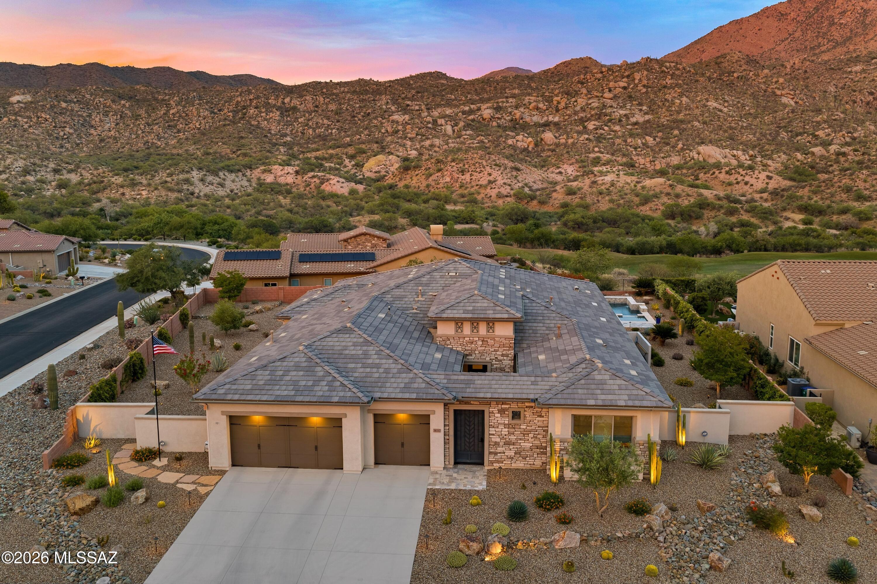 Exquisite meticulously maintained 4 BR, 4.5 BA, Bacara with private Casita, Pool, Spa & sweeping Mountain Views on a premium corner lot in The Preserve. Striking curb appeal with stacked stone accents and gated travertine courtyard sets the tone for this exceptional residence. Private Casita offers a serving station, closet, and bath with walk-in shower. Custom front door opens to Great Room featuring a designer media wall, sleek linear electric fireplace, and dramatic wall of sliders framing mountain views. The chef's kitchen is a showpiece with quartz countertops, Wolf appliances, Sub-Zero refrigerator, gas cooktop, oversized island, custom cabinetry, R/O system, and butler's pantry with wine cooler. Owner's retreat features an extended spa-like ensuite with quartz finishes, curbless walk-in shower and custom-designed walk-in closet. Dedicated den/office with illuminated media wall and elegant powder room. All Bedrooms feature private ensuites with walk-in showers. Custom & motorized blinds throughout. Well-appointed laundry room with sink, cabinetry and storage closet. Expansive 3-car garage with epoxy coated floor, custom cabinetry, mini split, water softener, and side access. Resort-style outdoor living with covered travertine patio, built-in BBQ with side burner, dual electric rolling shades, extended travertine patio, firepit, heated pool, spa, putting green, lush landscaping with extensive lighted nightscaping--all perfectly positioned to capture stunning mountain views.