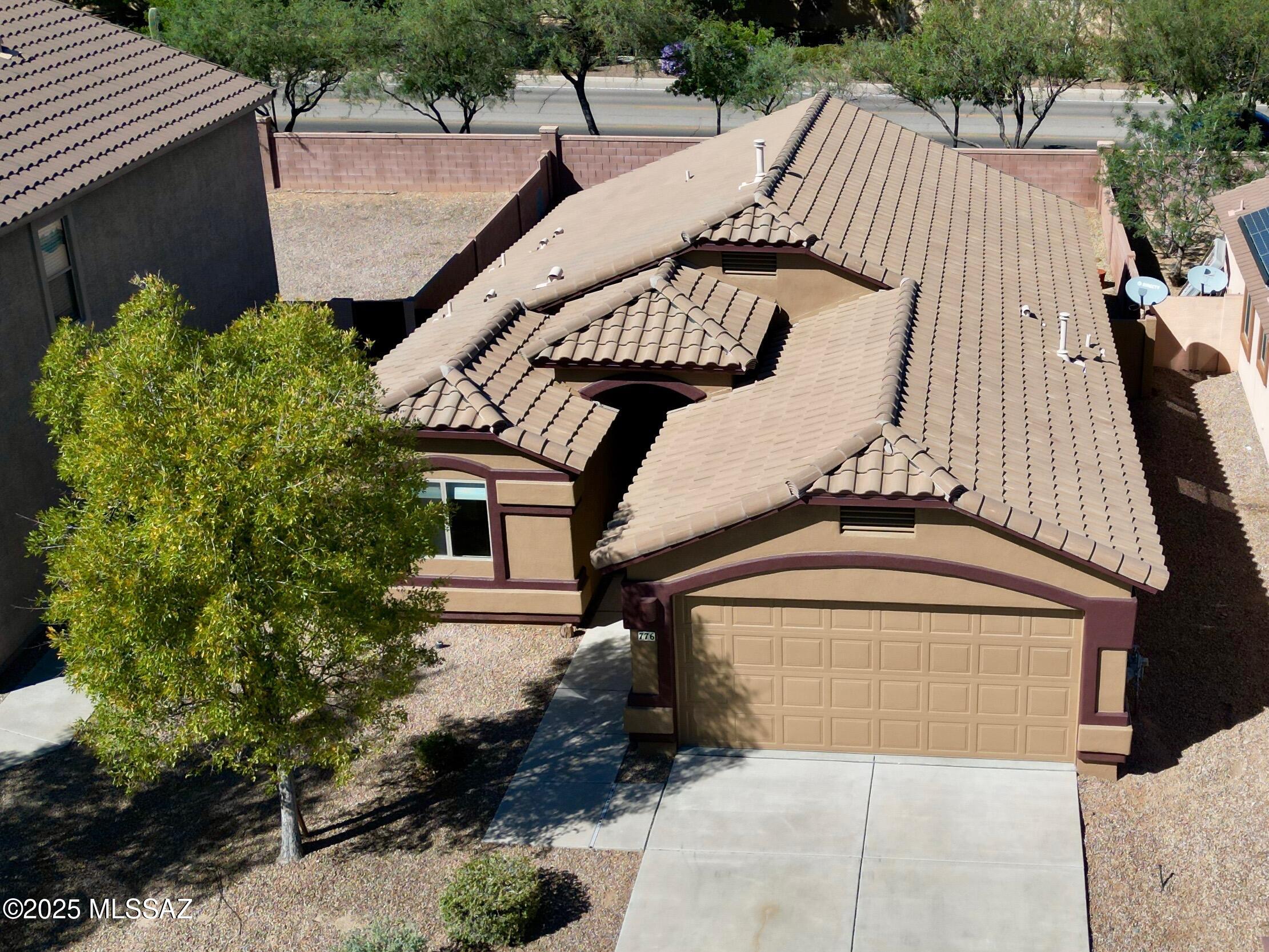Discover effortless living in this beautiful 3 bed/2 bath home in the coveted Rancho Sahuarita community. Freshly painted inside and out, the home greets you with brand-new carpet in the bedrooms and sleek tile flooring throughout the main living areas. The open-concept kitchen is a chef's delight, featuring abundant cabinet storage, a spacious pantry, and a seamless flow into the great room. Retreat to the primary suite, complete with dual vanities, a walk-in shower, and a generous walk-in closet. Outside, the covered back patio faces north, offering constant shade and comfort for year-round outdoor enjoyment. Just blocks away, you'll find the North satellite pool, community park, and scenic walking paths, making it easy to embrace the resort-style lifestyle Rancho Sahuarita is known for. you'll find the North satellite pool, community park, and scenic walking paths, making it easy to embrace the resort-style lifestyle Rancho Sahuarita is known for."