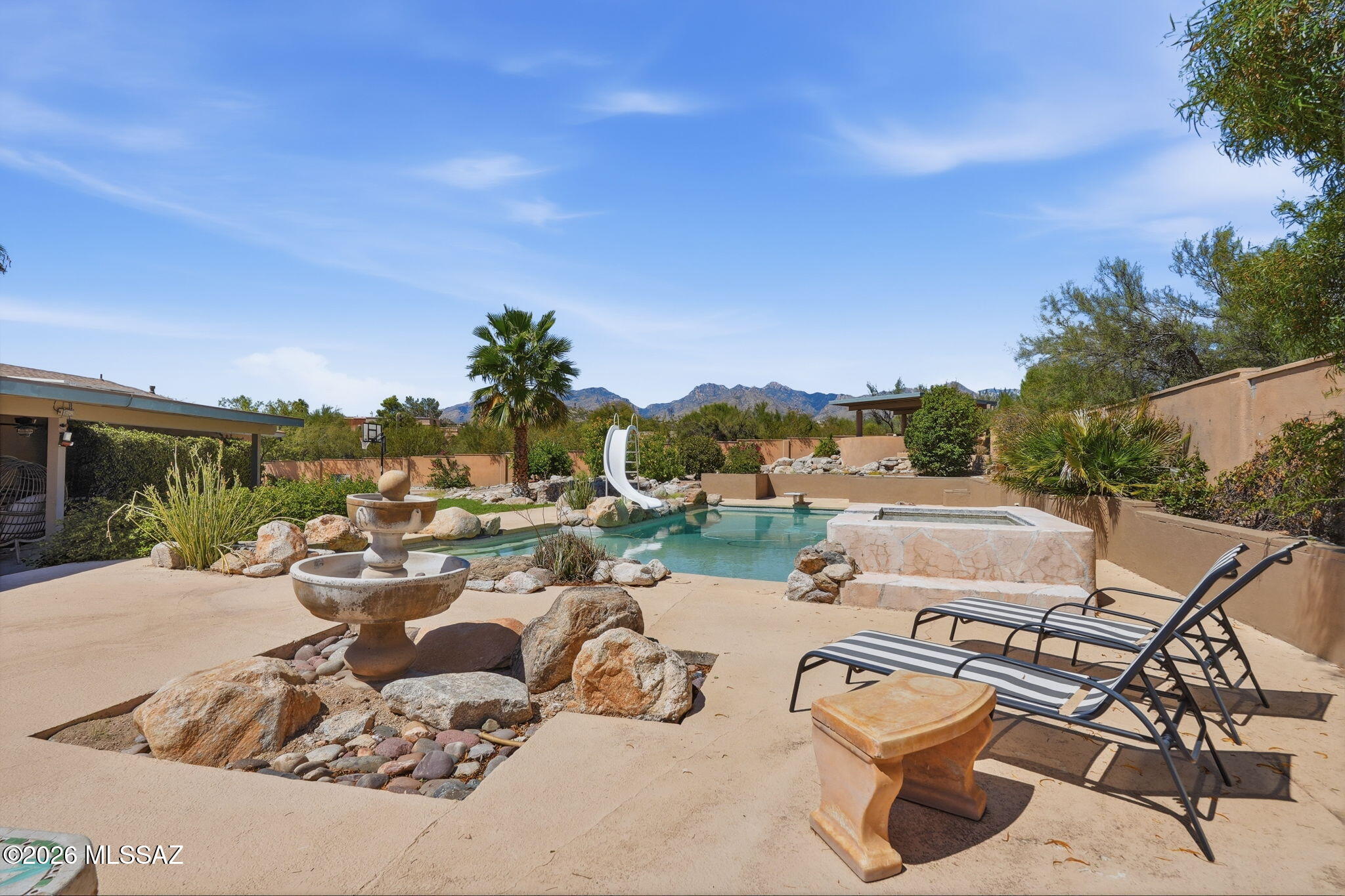 Rare opportunity to own a stunning modern estate with guest house on a 1.06 acre corner lot with beautiful mountain views! The 3,007 SF main home offers 4 bedrooms, 3 baths, a 3-car garage, and beautiful scored concrete floors throughout. The impressive chef's kitchen features an oversized island with counter seating, prep sink, induction cooktop, double ovens, warming drawer, wine fridge, and additional breakfast bar. A separate 1,010 SF guest house built in 2018 includes a full kitchen, 1 bedroom, 2 baths, and garage--ideal for guests.  The resort-style backyard features a covered patio, oversized pool with spa, and sport court. Privacy, views, space, and incredible indoor-outdoor living! Owned Solar & New roof installed in 2023! Closing  would need to be after November 30, 2026.
