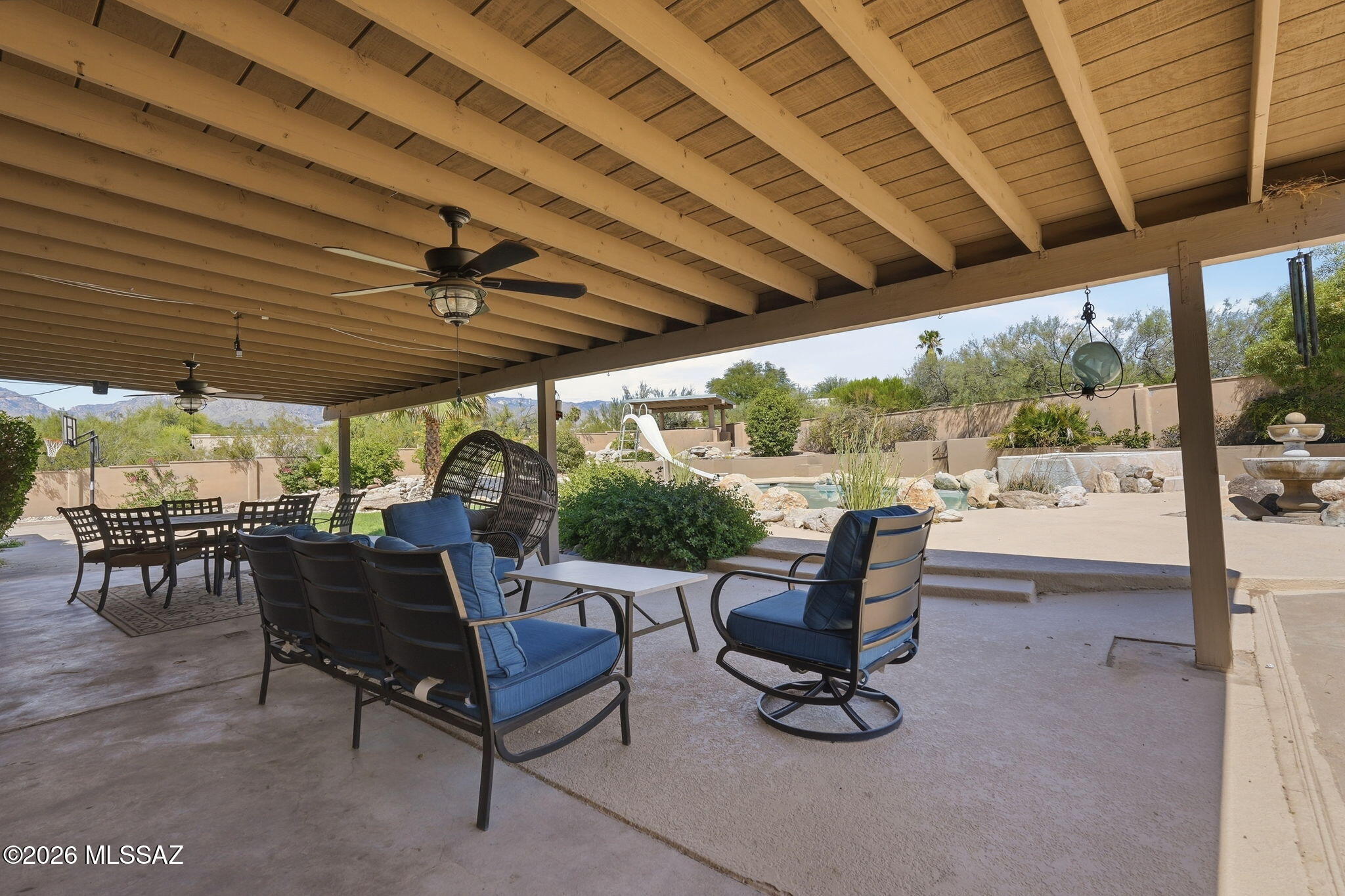 Rare opportunity to own a stunning modern estate with guest house on a 1.06 acre corner lot with beautiful mountain views! The 3,007 SF main home offers 4 bedrooms, 3 baths, a 3-car garage, and beautiful scored concrete floors throughout. The impressive chef's kitchen features an oversized island with counter seating, prep sink, induction cooktop, double ovens, warming drawer, wine fridge, and additional breakfast bar. A separate 1,010 SF guest house built in 2018 includes a full kitchen, 1 bedroom, 2 baths, and garage--ideal for guests.  The resort-style backyard features a covered patio, oversized pool with spa, and sport court. Privacy, views, space, and incredible indoor-outdoor living! Owned Solar & New roof installed in 2023! Closing  would need to be after November 30, 2026.