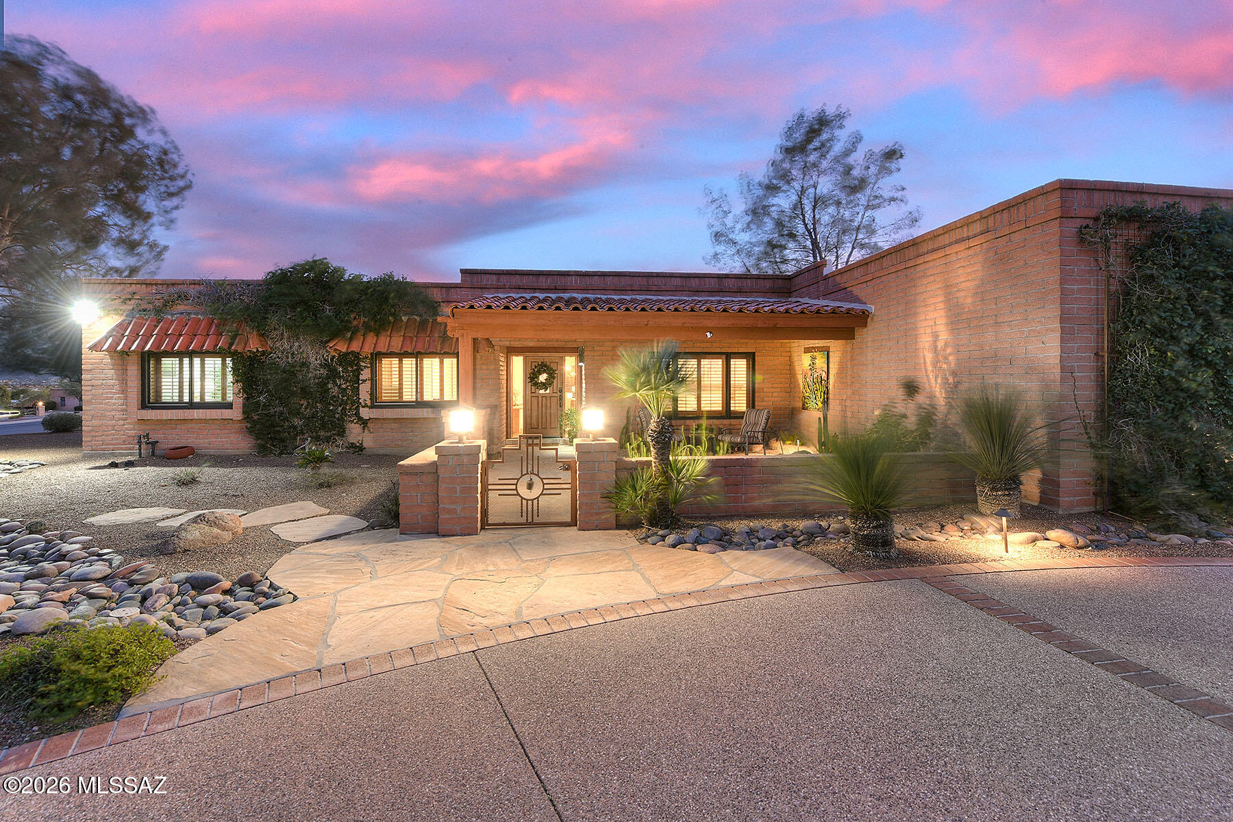 Freshly updated territorial-style home in coveted Sabino Vista Hills sited on a generous corner lot w/ mature custom landscaping. Recent improvements incl all new flooring throughout, new interior paint, redesigned interior entry, & completely remodeled guest bath & laundry area. Bright, open living spaces incl formal living room w/fp, lovely dining rm, & the kitchen is a highlight w/ granite counters,  cherry cabs,  6-burner gas range, SS appliances, wine fridge, gallery lighting, & large island that opens to the family room, which features an exposed brick 2nd fp & built-ins. Primary suite offers private French-door access to the backyard, walk-in closet, & double vanity w/ a walk-in shower. Mountain views & fantastic outdoor amenities include an -(SEE MORE...) extended covered/shady porch for year-round entertaining, built-in BBQ, conventional spa, custom gazebo/ramada, and a cozy fire pit area. Custom window shutters throughout. The garage provides ample storage with overhead racks and large closets, perfect for hobbies or gear. Residents enjoy community perks including a lap pool and spa, clubhouse, lighted tennis/pickleball courts, and regular neighborhood events. This home pairs thoughtful updates with spacious indoor/outdoor living in a desirable, amenity-rich community. Charming, welcoming, wonderful home!