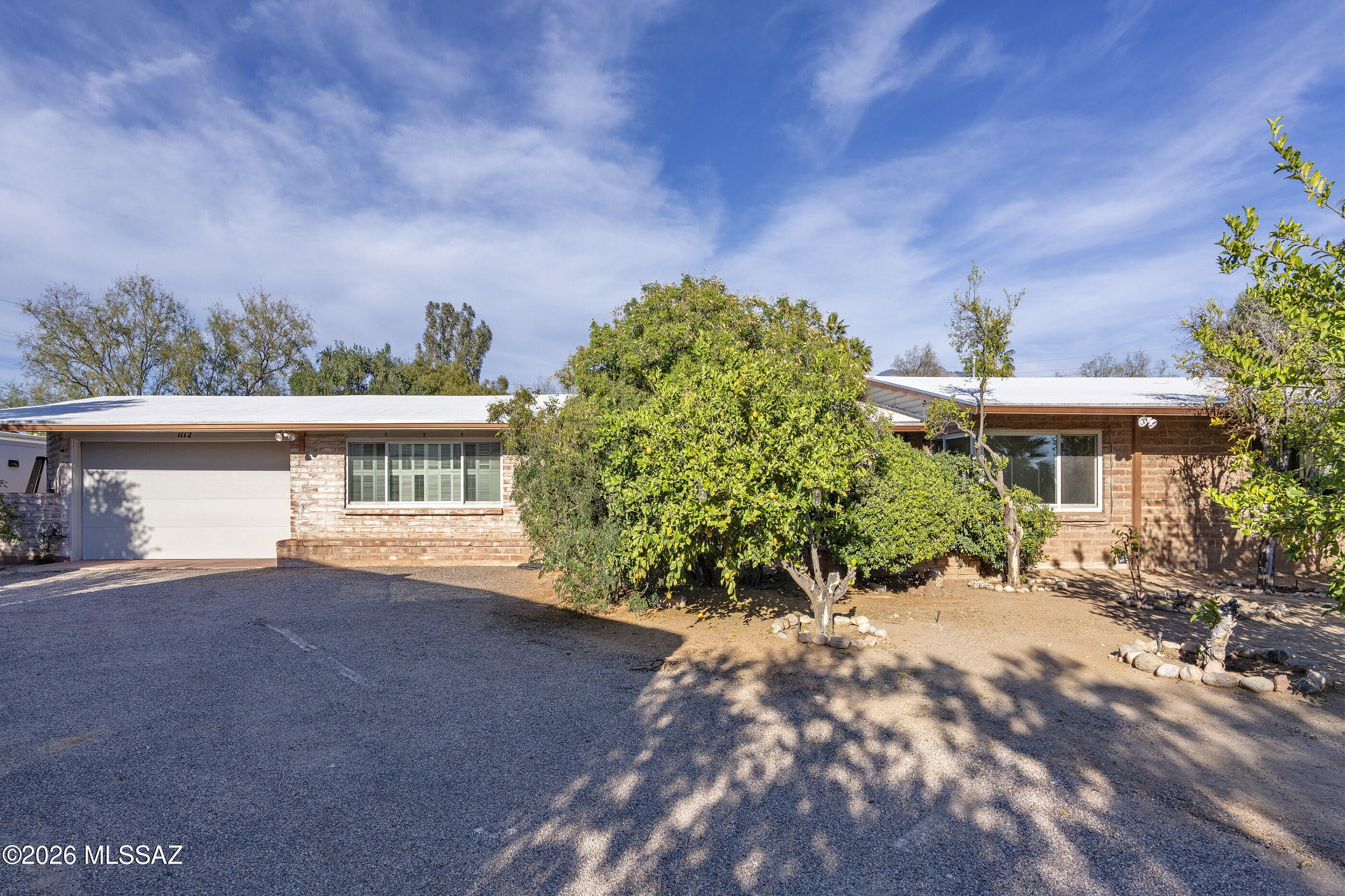 NEW - LOW PRICE - below appraised value! Sought after Casa Adobes neighborhood w/views of the Catalinas!  Large lot, an acre +, tucked away in a Cul-De-Sac.  The flowing floor-plan features a spacious great room w/exposed brick fireplace as well as a separate family room w/built-ins & cedar closet. The gourmet kitchen has soft close cabinetry, double oven w/warming drawer, 5 burner gas range & granite counters. Ceramic tile & laminate flooring throughout.  TWO NEW BOSCH HVAC SYSTEMS! NEW POOL FILTER. NEW ELECTRIC SVC. 50 AMP SVC. CIRCUIT INSTALLED FOR CAMPER. ROOF 2021. NEW SEPTIC. NEW SEPTIC SYSTEM.  Office/den w/built-ins, 3 generous sized bedrooms. Private & serene yard w/extended cvd patio & refreshing fenced pool.  Close to Casas Adobes shopping center, Whole Foods, restaurants. The  house is incredibly energy efficient due to new HVAC, slump block construction, reflective roof, and high quality windows.  Plenty of parking for all the toys, fruit orchard, and huge covered. Storage shed.  Don't forget to walk the property - lots of land beyond the adobe fence in the back.  It feels like a park - very shady and relaxing.  A very special smaller patio on the east side of the home.  All this and so private at the end of a cul de sac.