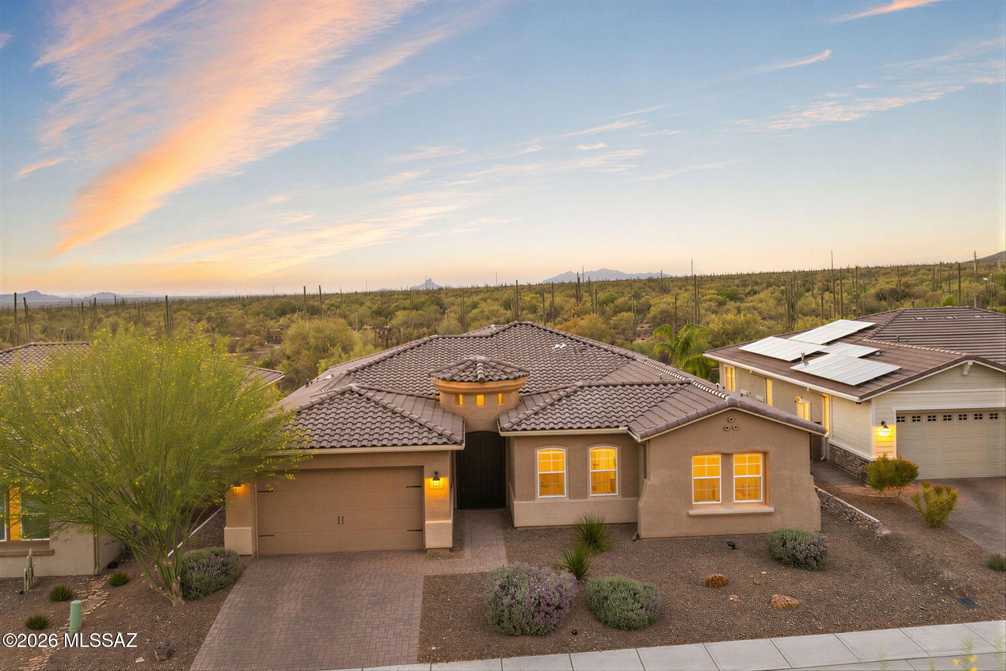 Nestled in Marana's prestigious Dove Mountain, this 3,032 sq ft 4 bed/3.5 bath home offers spectacular Sonoran Desert living. Framed by unobstructed, panoramic sunset views with privacy and no neighbors behind, the premium lot integrates seamlessly with nature through your expansive courtyard slider.
Inside, meticulously curated upgrades elevate daily living. The gourmet kitchen features large center island, butler's pantry, complemented by a custom drop zone, dedicated office/den, and a 3-car tandem garage. Guests enjoy ultimate privacy in a rare second en-suite bedroom. Enjoy sophisticated modern design with serene desert tranquility in a resort setting. Minutes from The Golf Clubs@ Dove Mountain, Amazing trail systems, and ''A'' rated CSTEM K-8 schools; Call today for a private showing