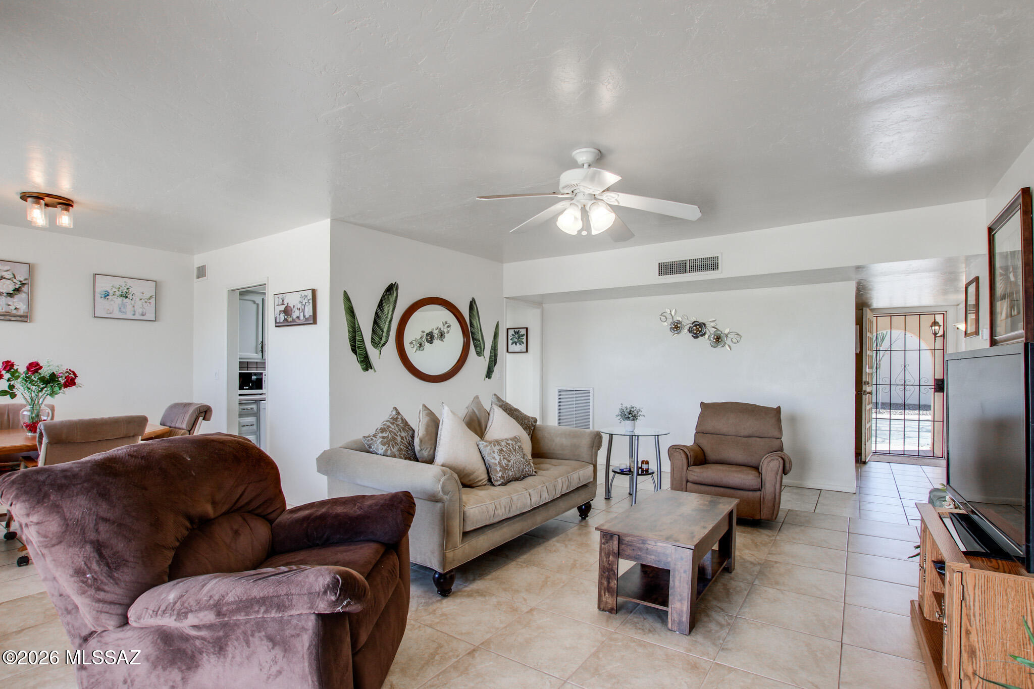Welcome to 790 S Ciudad Circle, a thoughtfully maintained 2 bedroom, 2 bathroom townhome offering 1,231 square feet of comfortable living in a convenient east side Tucson location. The spacious living area is filled with natural light, while the kitchen offers ample cabinet space and a functional layout for everyday living. The primary suite includes its own private bath and generous closet space, and the private patio adds a great spot to relax outdoors. With covered parking, low maintenance living, and close proximity to shopping, dining, parks, and daily conveniences, this home offers comfort, simplicity, and value in one inviting package. Can be sold furnished for an even more seamless move.