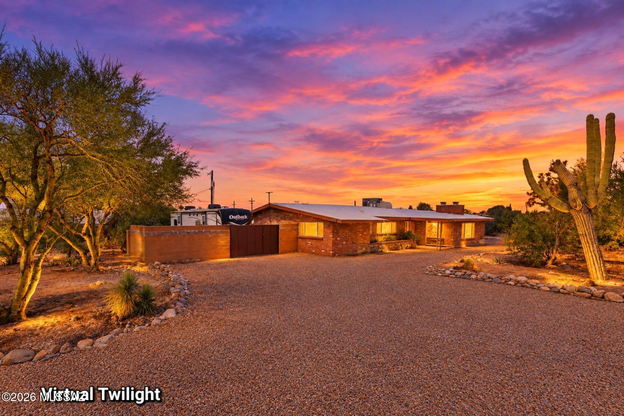 Rare Foothills opportunity offering stunning mountain and city views on a flat 0.77-acre corner lot. This updated 4-bed, 2.5-bath home features a remodeled kitchen, modern baths, classic fireplace, and dual-pane windows. The fenced backyard includes a private hot tub, covered patio, RV gate, full hookups, and 50-amp service. Exceptional utility spaces set this property apart, boasting an attached 2.5-car garage, massive storage room, dedicated tool closet, large workshop, and a breezeway with a roll-up door and 60-amp subpanel with room for a 50amp circuit. A hard-to-find blend of central elegance, expansive outdoor space, and unmatched workshop versatility. Experience this unique property in person!
