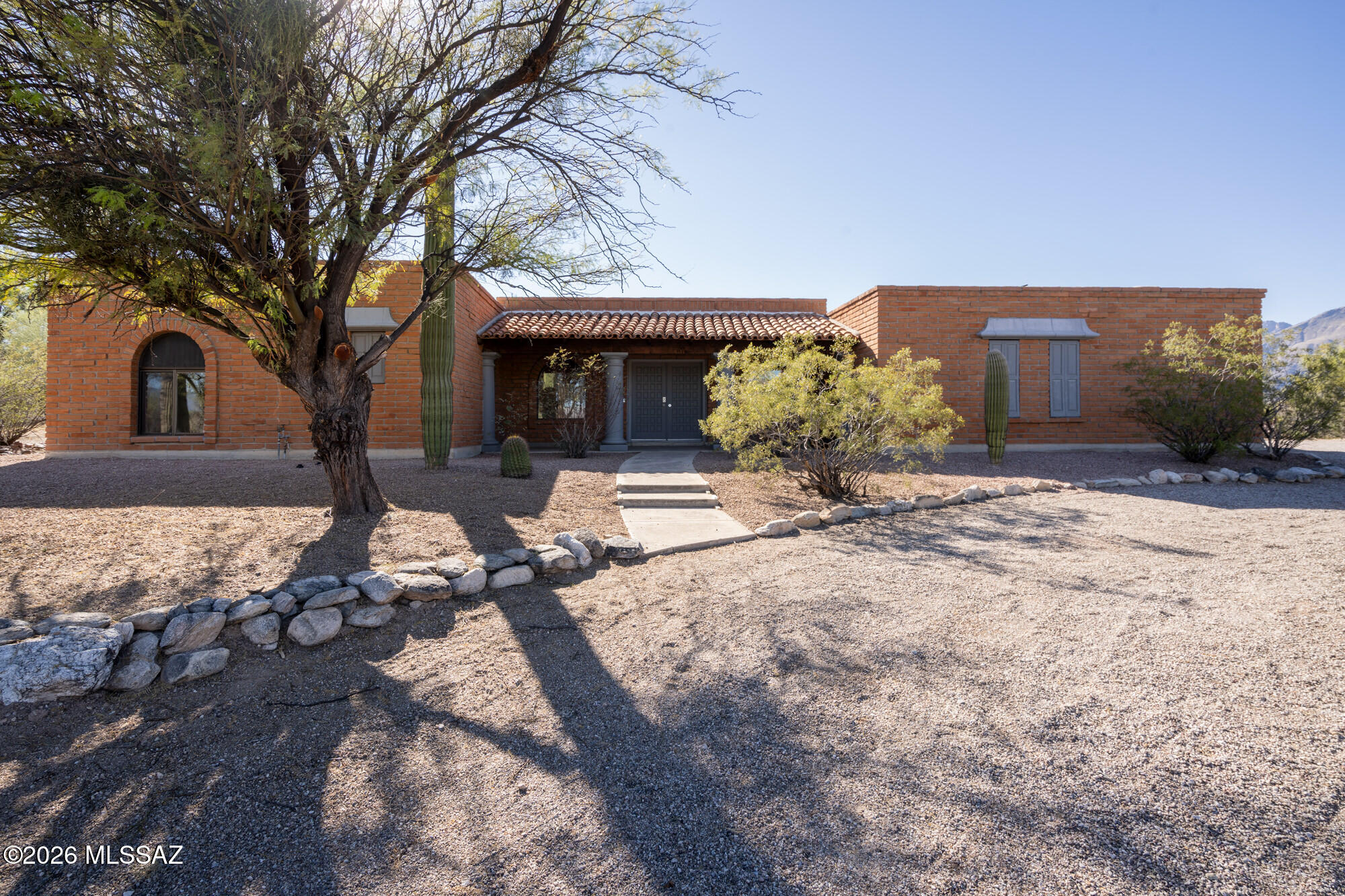 A home in Hidden Valley with a sparkling pool, separate guest house, and a location that rewards daily life. Kids can walk or bike to both primary and middle school. Sabino Canyon is minutes away with hiking and biking trails. 8kW owned solar system, installed by TFS in 2019 which keeps energy costs low without the complication of a lease. The main residence, offers three bedrooms and two baths. The living and dining room flow together as one generous space, extending into an Arizona room that opens directly to the pool -- indoor and outdoor living connected without effort. Off the kitchen, the family room with its fireplace is where the day winds down, enjoying the view. A detached guest house extends the property's possibilities. One bedroom, one bath, a living space, and a kitchenette -fully self-contained and ready for rental income, extended family, or guests who want their own front door.

Along with the walk-ability and the proximity of track out to Seven Falls for a cool swim. The Loop is a ten-minute drive. Canyon Ranch is three minutes from your door. La Encantada is fifteen minutes when you're ready for a meal or an afternoon out. Hidden Valley has a voluntary HOA that gives access to a private nature conservancy called Wes Miller Park created by the original developer, accessible exclusively to residents.