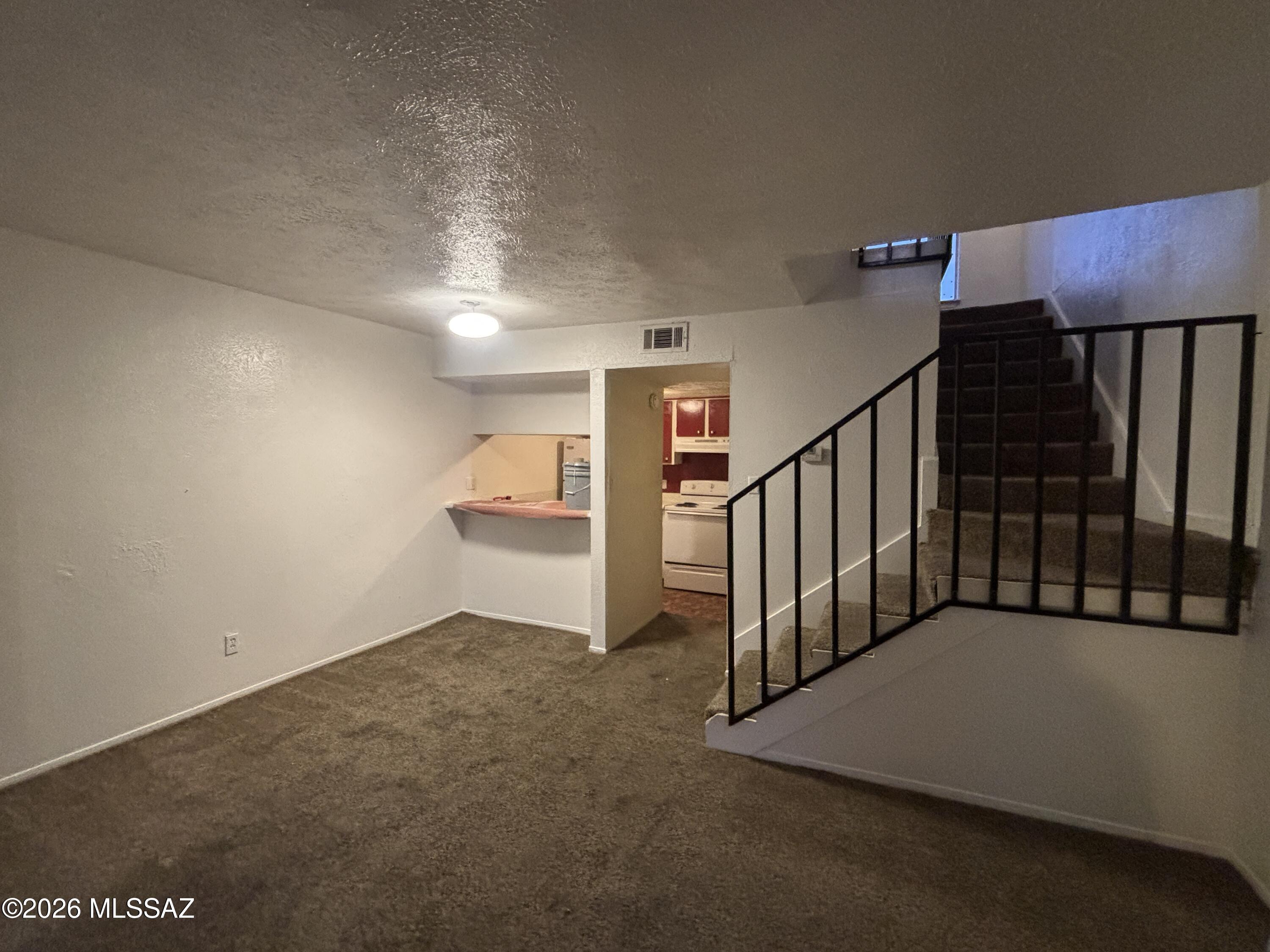 This well-kept 1-bedroom, 1.5-bath loft-style condo located on Tucson's east side. The first floor features a breakfast bar, living room, and a half bath. The kitchen is equipped with a stove, refrigerator, and dishwasher.
Upstairs, the loft-style bedroom offers generous natural light through large windows and includes a full bath.
Community amenities include a pool, along with covered utilities for water, trash, and sewer. The property is situated close to retail, dining, medical services, and major transportation routes