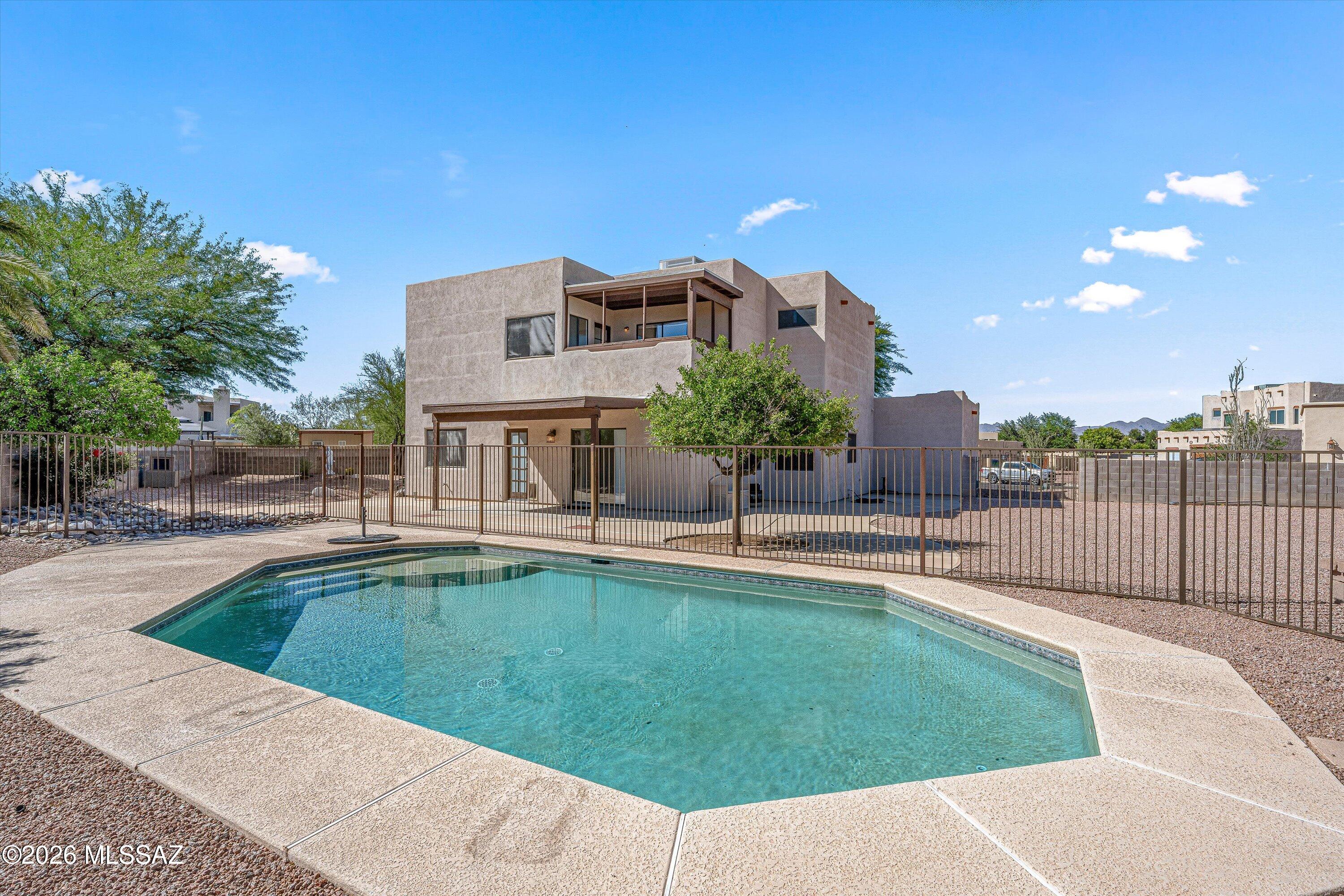 The home you've been waiting for has finally arrived! This Continental Ranch gem is a rare find, situated on nearly a half-acre cul-de-sac lot. From the moment you arrive, the expansive driveway and 3-car garage provide ample room for parking and storage. Inside, this 4 bedroom 2.5 bath home opens to a formal living room bathed in natural light. The true showstopper is the gorgeous kitchen, which features gorgeous wood dovetail cabinetry, granite countertops, stainless steel appliances, and an island perfect for entertaining. Off the kitchen is a spacious family room and a convenient powder bath, which has direct backyard access, ideal for those coming in from the pool. Upstairs, the primary suite is complete with a double vanity, separate soaking tub, walk-in closet, and a private balcony offering spectacular views of Sombrero Peak. The backyard is an absolute paradise with a sparkling pool and surrounded by a massive lot that serves as a blank canvas for your dream outdoor retreat. Perfectly located just minutes from I-10, schools, dining, and shopping, this home truly has it all.
