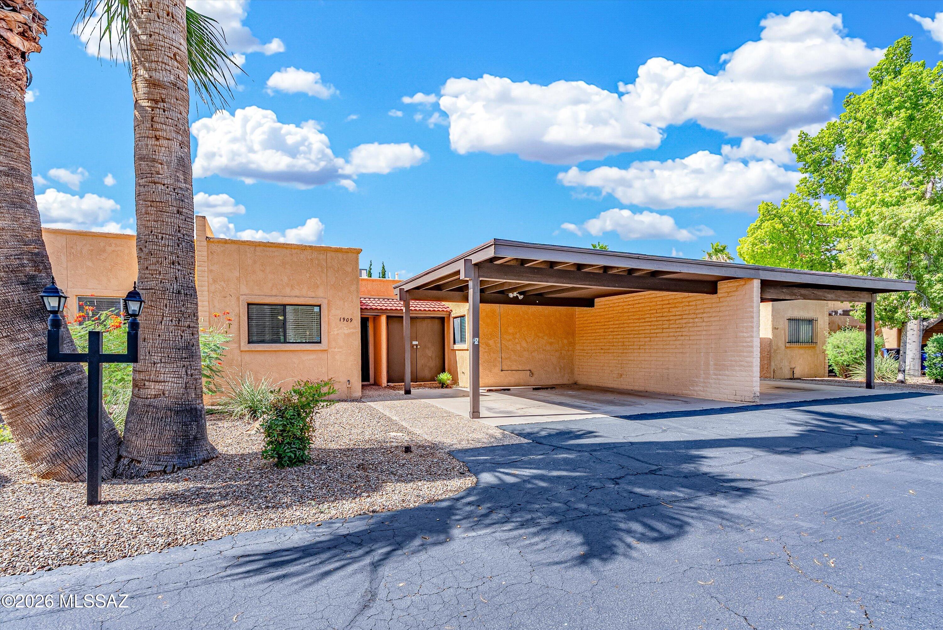 Tucked away in Verde Vista Villas, this single-level 2-bedroom, 2-bath townhouse has more personality than you might expect. Step inside to tile floors, a classic beehive fireplace, an eat-in kitchen with stainless appliances, and a primary suite with dual closets and a private bath.

Out back, the covered Saltillo-tile patio, desert landscaping, spa, and natural gas BBQ create a private place to unwind. A newer foam roof (11/2024) with a transferable 10-year warranty, dual-pane Low-E windows, full irrigation, two covered parking spaces, and community pool access add practical value. Come see why this hidden-in-plain-sight Tucson home is worth a closer look. Some homes are easy to spot from the main road. Others are tucked away just enough that you may have passed them for years without ever knowing they were there.

1909 N Linden Circle is one of those homes.

Set in Verde Vista Villas, this single-level 2-bedroom, 2-bath townhouse offers a comfortable mix of Tucson character, private outdoor space, and an easy-to-live-in layout.

A classic beehive fireplace anchors the living area, giving the room a warm Southwestern feel you don't find in every home. Tile flooring runs through the main living spaces, while the eat-in kitchen offers stainless steel appliances, pantry storage, and room for everyday meals without feeling separated from the rest of the home.