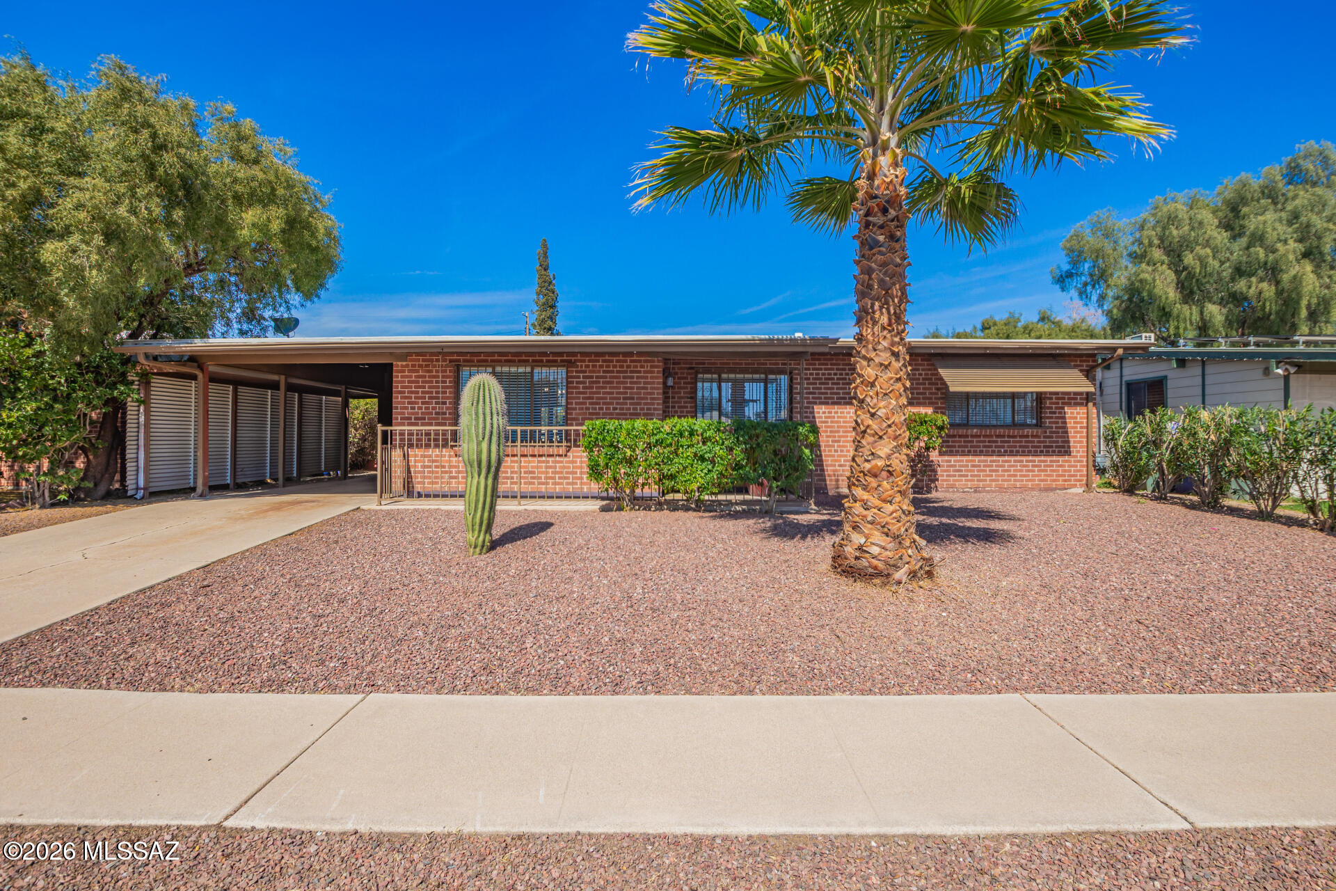 Beautiful single-story brick style home with 3 bedrooms, 2 baths and attached carport located in a wonderful neighborhood in  Tucson: NO HOA-Recoated ROOF, remodeled bathrooms lots of updates , Backyard basketball court ! Wood look flooring throughout, no carpet! Large family room, open kitchen featuring SS appliances, gas range, garden window, white crisp cabinetry, and modern counters.  Peaceful master includes private ensuite with stand in tile shower with pebble floor and vessel sink. Large backyard has covered patio and has plenty of space for a pool or future projects.
