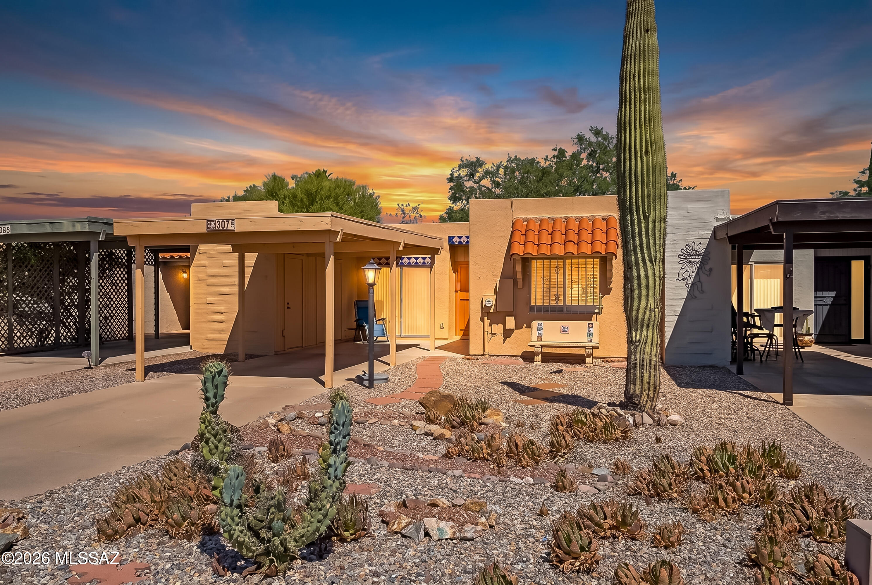 Inviting townhome in Casa Paloma II that has been lovingly updated and lightly lived in! Remodeled baths, updated kitchen, shutters, natural light, plenty of storage, and covered back patio. Easy maintenance indoors and out. Short distance to community pool and part of the GVR!