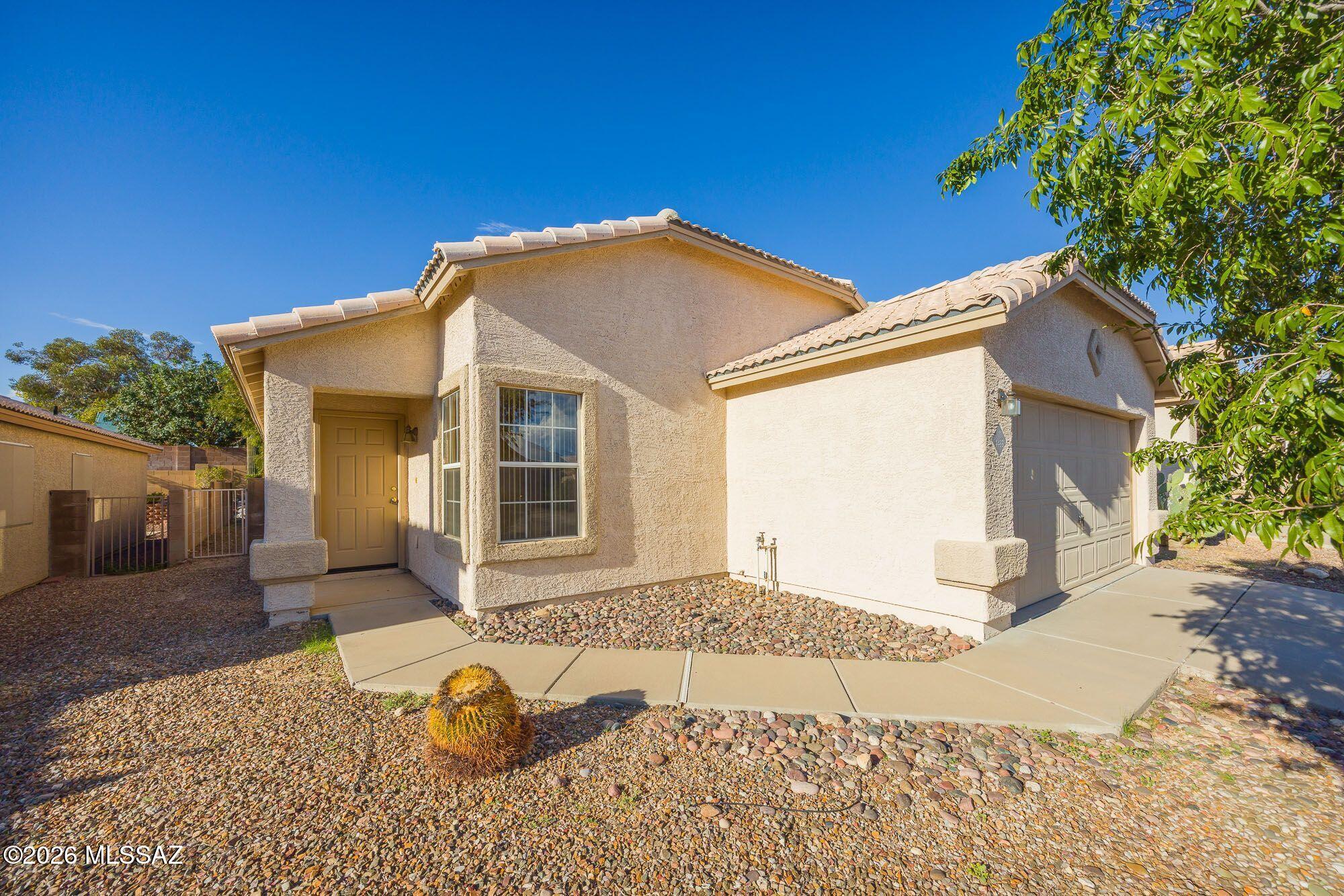 A perfect starter home in a quiet, clean northwest Suncrest neighborhood. This home features 4 bedrooms, 2 full bathrooms, formal living / dining, eat-in kitchen, it is tiled throughout, appliances are included, and offers E-Z care yard. The location is excellent with nearby shopping, dining, school, Pima community college, YMCA, and I-10 access.