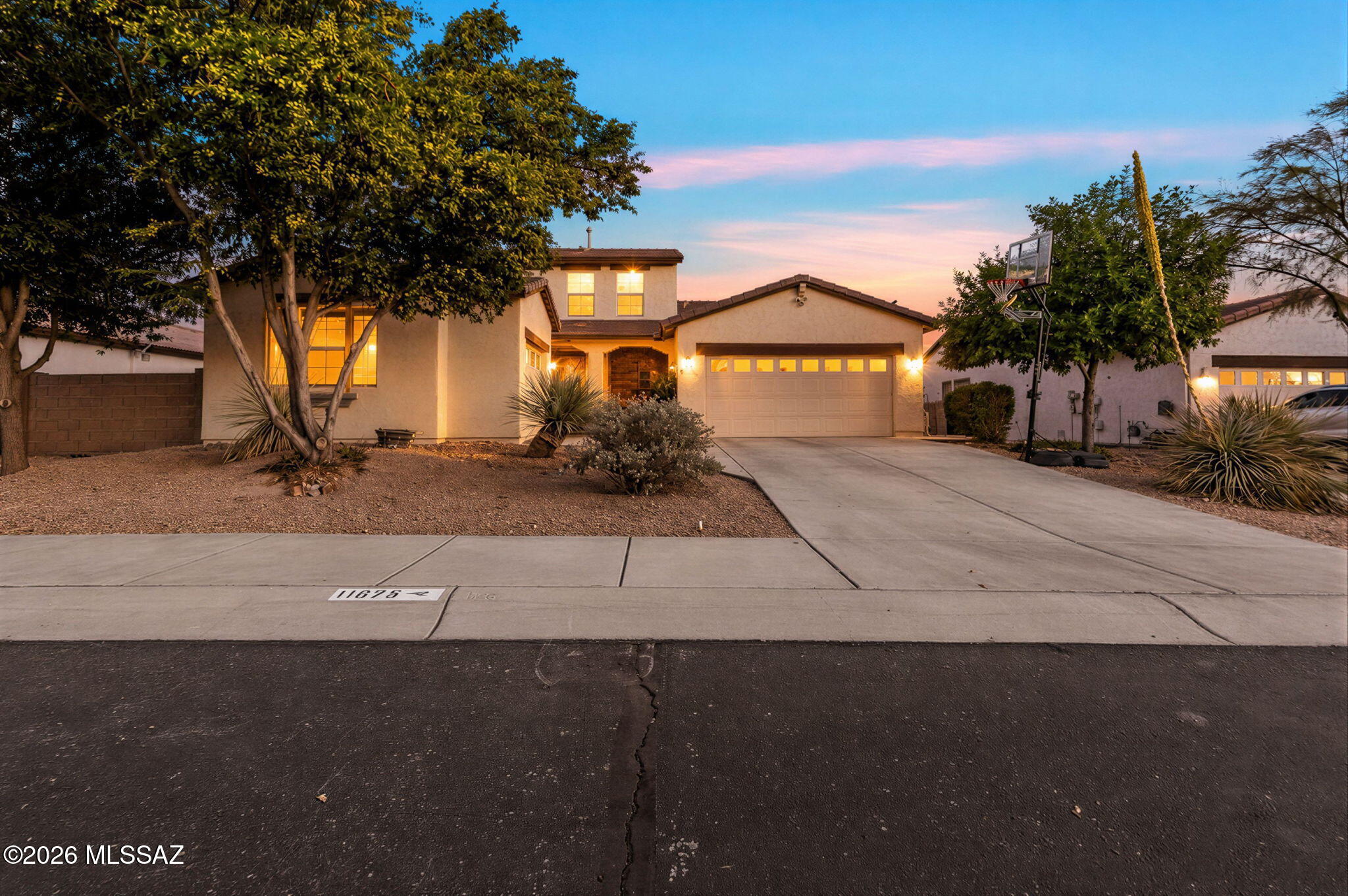 Stunning example of why HallCraft homes was one of the best in Gladden Farms! Over 2800 sf of living space, with 4 bedrooms, 2 1/2 bathrooms and a desirable 3 car garage. This home has it all. Large open concept. Main level primary suite with access to pool and spa for those AZ evenings. No carpet throughout main level with custom tile and laminate flooring. Solid surface counters compliment the large entertainer's kitchen space with large pantry. Side yard offers extra room to play, and mature landscaping give the final touches to this backyard oasis. Downstairs has large Den and 1/2 bath option while the upper floor has a large loft area and built in media for movie night. Come see all that this home has to offer!