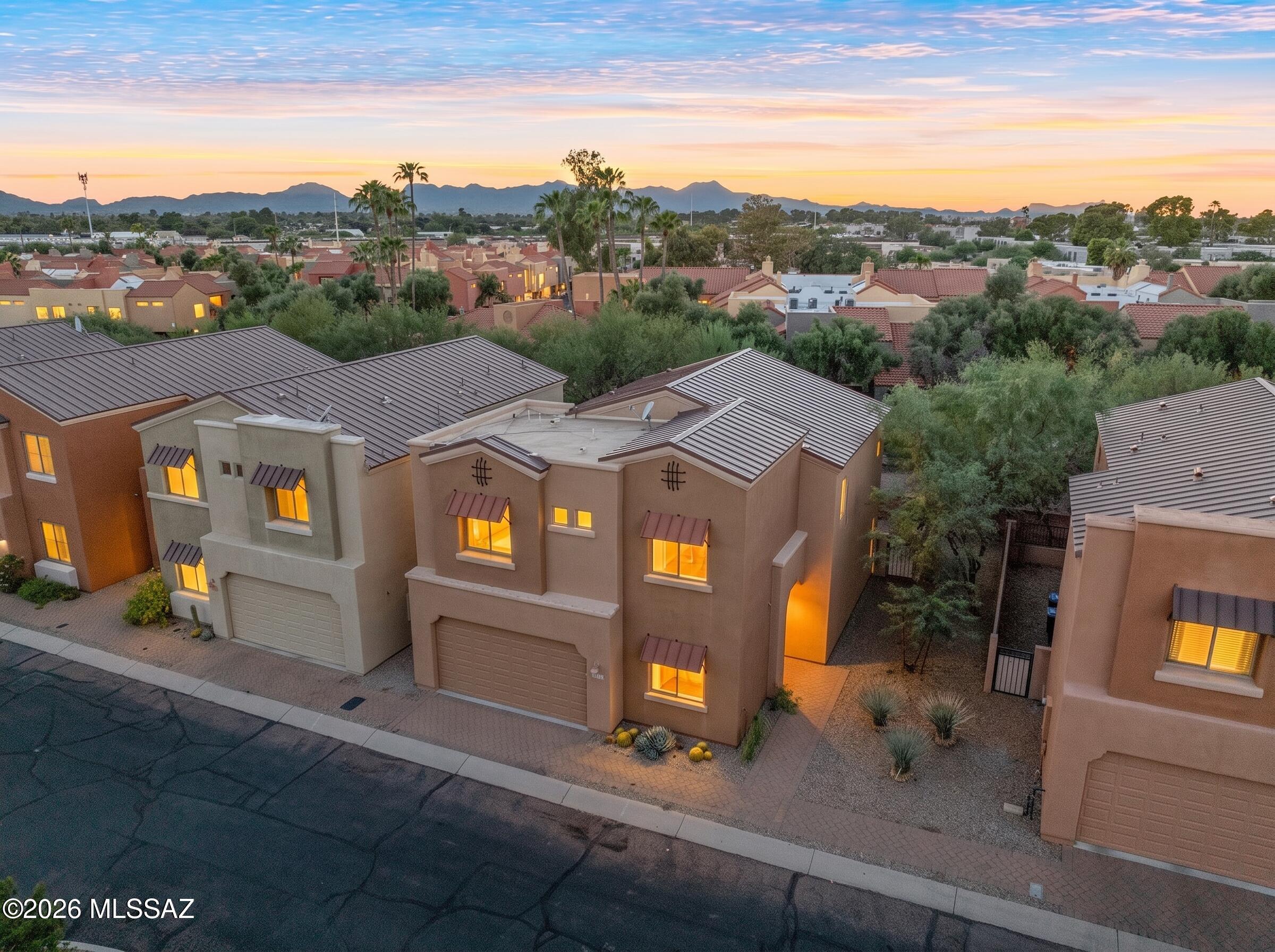 Excellent Location (River & Campbell) right on Rillito walk/bike path! SINGLE FAMILY HOME! Desirable gated River Walk subdivision! Very well kept home! 3bed/1den/2.5 bath 2190sqft. Bright open floor plan, AC thermostat controlled separately upstairs/downstairs. 2 dual sinks bathrooms for upstairs, 1/2 bath for downstairs. Huge bedrooms/living room with ceiling fans, extra den for your home office or hobby room etc. Beautiful backyard with artificial grass and pavers(low maintenance) AF Sterling built home. Lots of restaurants and shopping near St. Phillips Plaza's Farmers market.