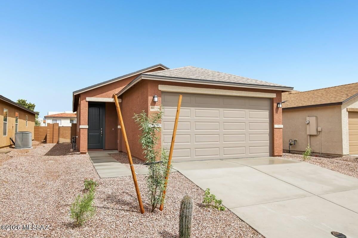 This home is open for self-guided tours daily 8 am - 8 pm. This single-story home features an open floor plan with abundant natural light, 9-ft. ceilings, and ceramic tile flooring throughout. Overlooking the great room, the kitchen boasts poplar cabinets, a peninsula, and Whirlpool® stainless steel appliances, including gas range, dishwasher, and refrigerator. Ample storage space is available at two-car garage, kitchen pantry, hallway linen closet, and entry coat closet. Enjoy the convenience of a dedicated laundry space with Whirlpool® washer and electric dryer. The covered back patio provides outdoor shade for dining and entertaining. Price includes discount predicated on using seller's preferred lender KBHS.