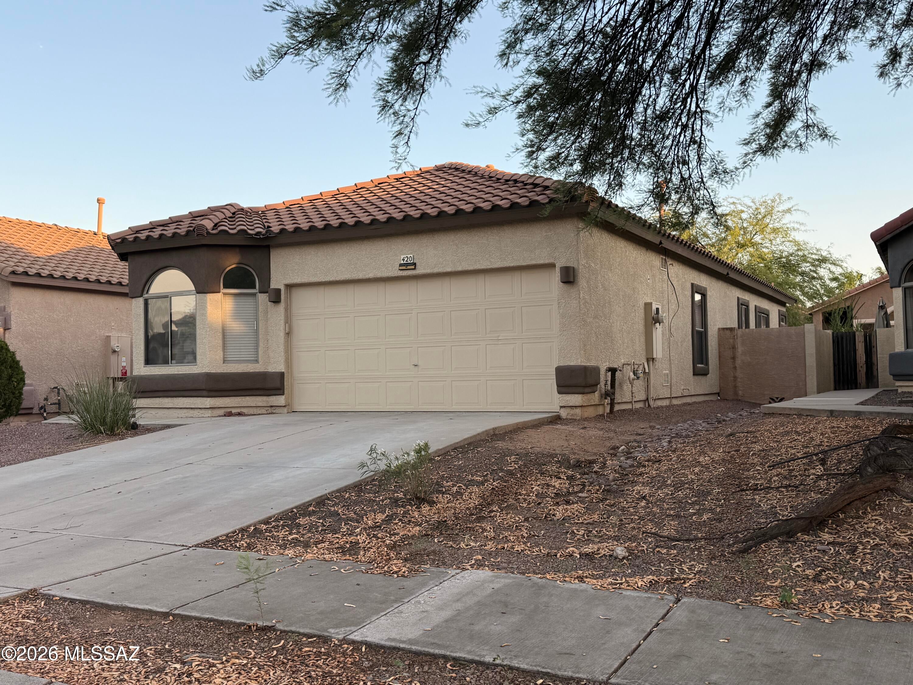 Seller will accept or counter offers from 274,900-299,900. Fully updated 4/2/2 home in Rancho Sahuarita. The open-concept layout includes vaulted ceilings, modern light fixtures, and brand new vinyl flooring throughout. At the center of the home, the kitchen boasts custom sage green cabinetry with matte black hardware, dark concrete countertops, a large center island, and black stainless steel appliances. Both bathrooms feature matching sage green vanities, dark concrete counters, black vessel sinks, and matte black fixtures, while the primary suite offers an updated ensuite with a double vanity and walk-in closet. Outside, the low-maintenance backyard features a shaded pergola structure and a concrete block privacy wall. Residents enjoy full access to Rancho Sahuarita's resort-style amenities, including the community clubhouse, fitness center, water park, pools, 10-acre Sahuarita Lake, dog parks, and miles of walking and biking trails. Positioned in a prime location just steps away the neighborhood park, the property is just minutes from Sahuarita Lake Park and Desert Diamond Casino, with quick access to both I-10 and I-19 for convenient commuting.