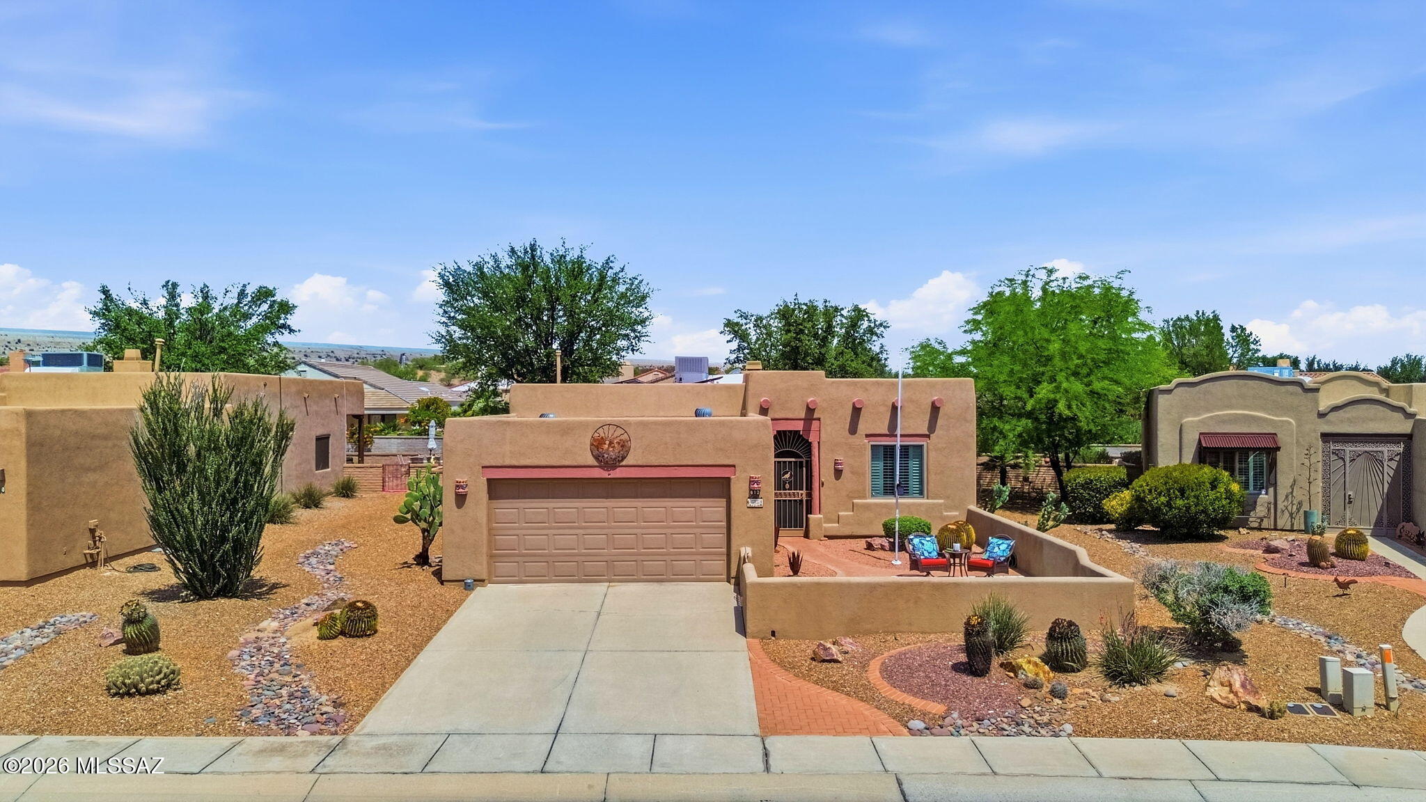 MUST SEE!!!!!!  This charming santa-fe style style Green Valley oasis boasts a premium lot location with southwest aesthetics true to the region.  The backyard is a true slice of paradise with beautiful landscaping, color, and privacy! The interior boasts BEAUTIFUL FLOORING AND FINISHES.   The Greens at Santa Rita is a gated community which has its own private pool, as well as access to all the other amenities such as the gym, club house, tennis courts, and golf. This home can be sold furnished, or cleared out to the buyers preference. DON'T MISS OUT on this great opportunity to secure your next home!