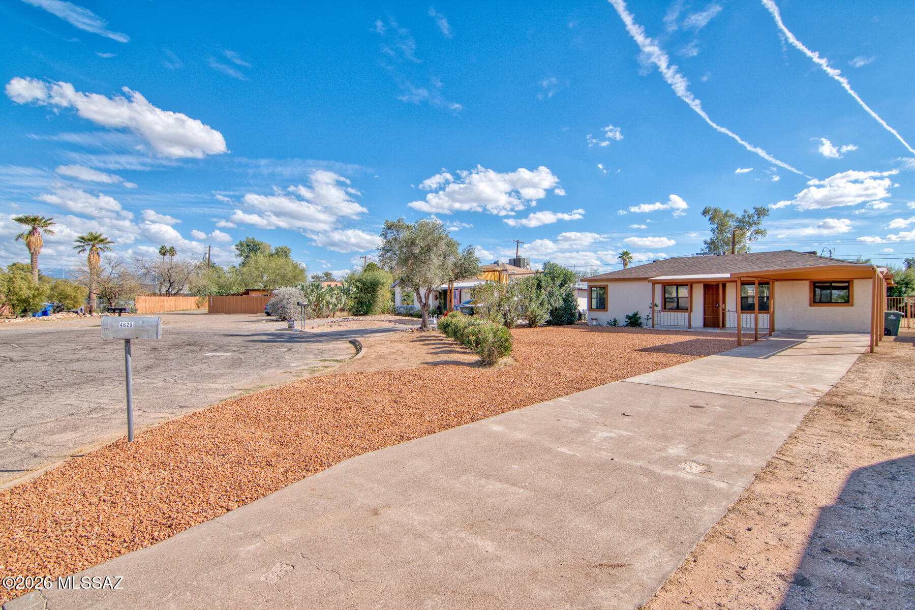 Range priced $250,000-$260,000. Beautifully updated home in great central location. Brand new kitchen with stainless steel appliances, stunning backsplash and recessed can lights. All new energy efficient dual pane windows, fresh paint on a neutral palette.  The cute front porch is perfect for ''front porch sitting while taking in the mountain view.  The spacious backyard is a blank slate just waiting for your creativity and includes a large storage that could double as a workshop or gardening storage. 1 car carport with plenty of parking space and space for an RV. NO HOA.  Wonderful central location convenient to downtown and U of A. Owner/Agent