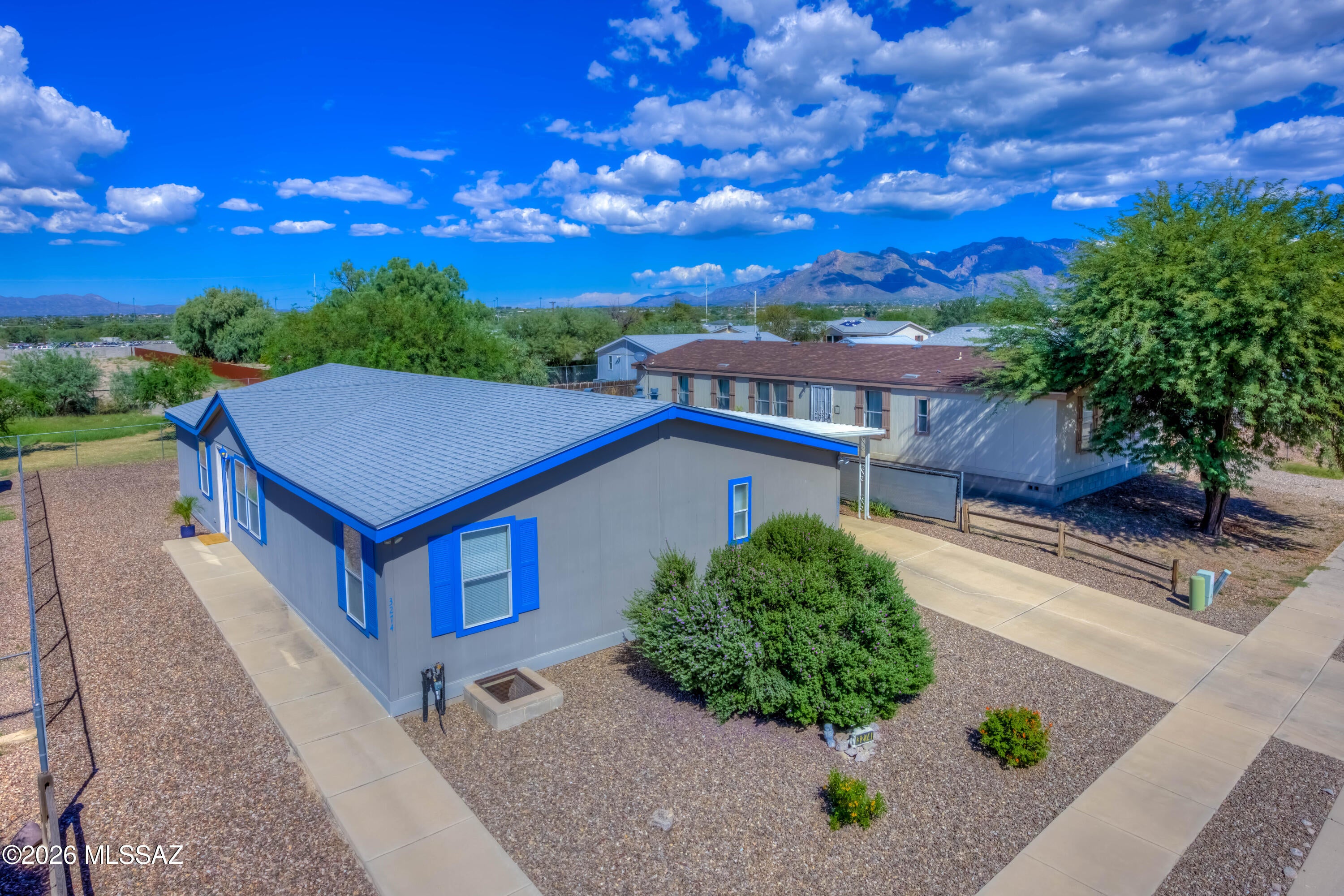 Privacy and space in a quiet, well-kept community! This 1792 sq ft, 4 bed, 2 bath MFH offers a functional split floor plan and has been lovingly maintained as a non-smoking home. Updates include a newer roof (2024) and new tile flooring (2026) in the entry and kitchen/dining area. The large living room is light and bright, ceiling fans throughout, and the primary suite offers a walk-in closet and private bath with oversized corner garden soaking tub. Outside you'll love the block skirting, carport parking, fully fenced backyard with mature shade tree, perfect for relaxation and BBQs. Storage shed conveys with the sale of the house. Tucked away in a very tidy small development with easy access to shopping and I-10.