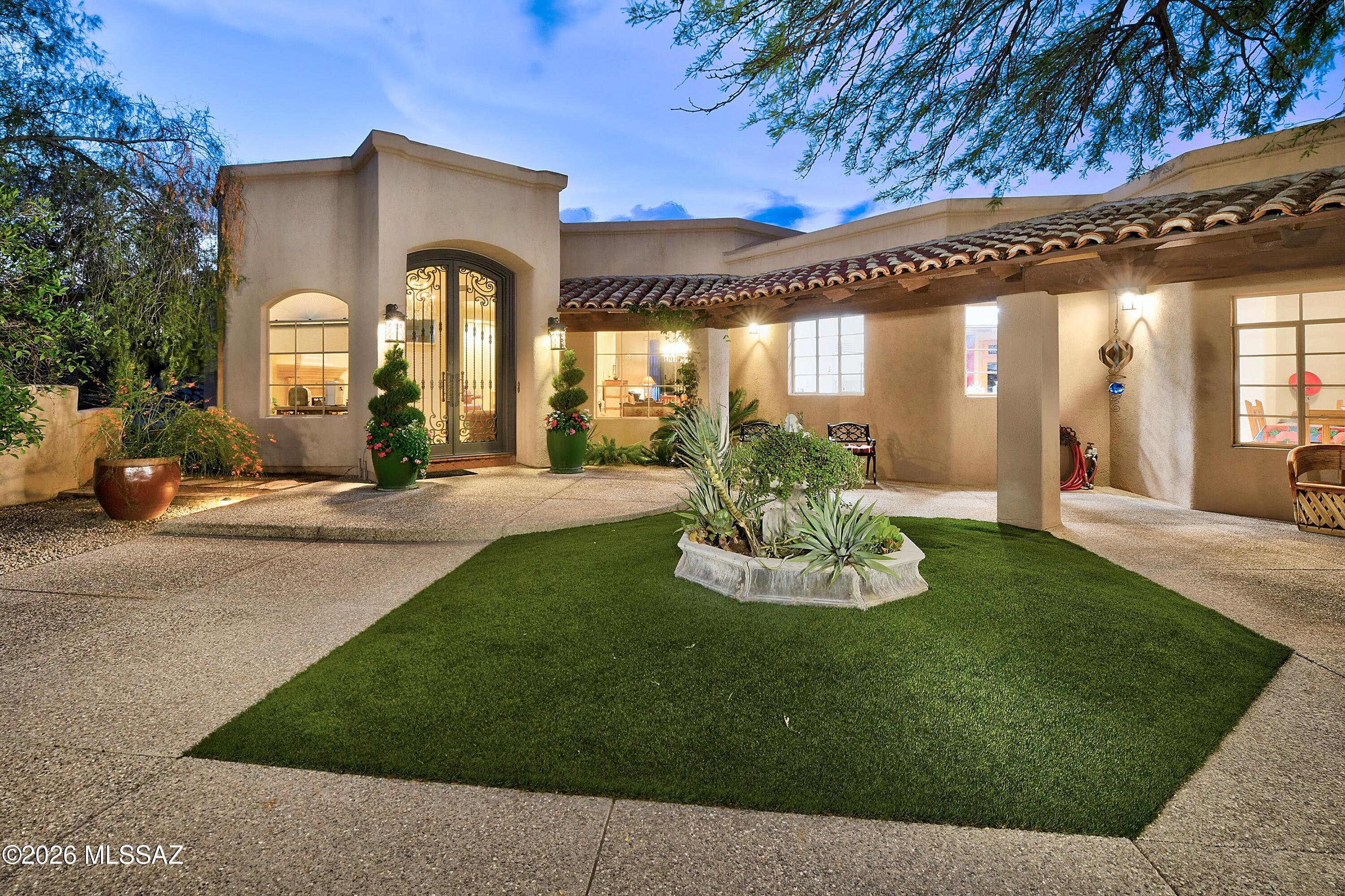 This elegant home nestled in the prestigious Cat 10 gated community offers breathtaking mountain views, timeless sophistication and your own private retreat with sparkling pool/spa, covered patio, outdoor kitchen, huge turfed yard and more spectacular views. Serene courtyard entry leads to a spacious foyer with fireplace and  welcoming family room that features an attractive wood ceiling.  Newer double sided built-in Sub-Zero fridge/freezer and Wolf cooktop offer premium performance in a gourmet kitchen boasting a large island, quartz counters and sunny breakfast nook. Spacious primary has sitting area and luxurious bath.  Split floorplan with terrific rec room and dedicated office/study w/built-ins adds flexibility and makes working from home a pleasure.  A truly exceptional home.