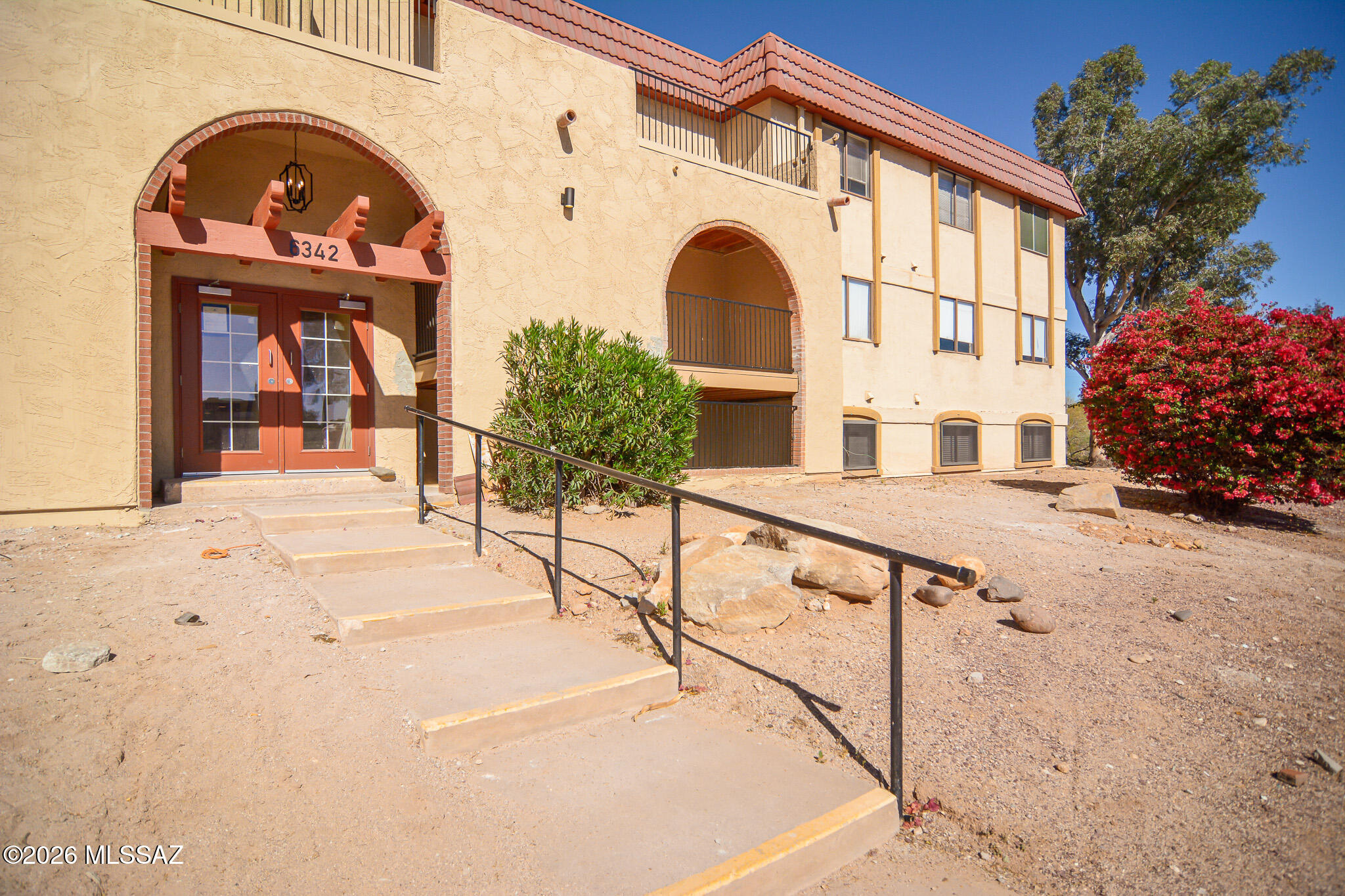 Beautifully remodeled Condo. Located in a convenient North Tucson Location. Rich wood look LVP flooring. Remodeled kitchen with SS appliances. New interior paint. Updated modern bathrooms. One assigned carport. Spacious upstairs owner's suite features double closets. New light fixtures and door hardware. Charming HOA includes a clubhouse, pool, private streets, and landscaping around the perimeter along with beautiful mountain views. This home shows beautifully.