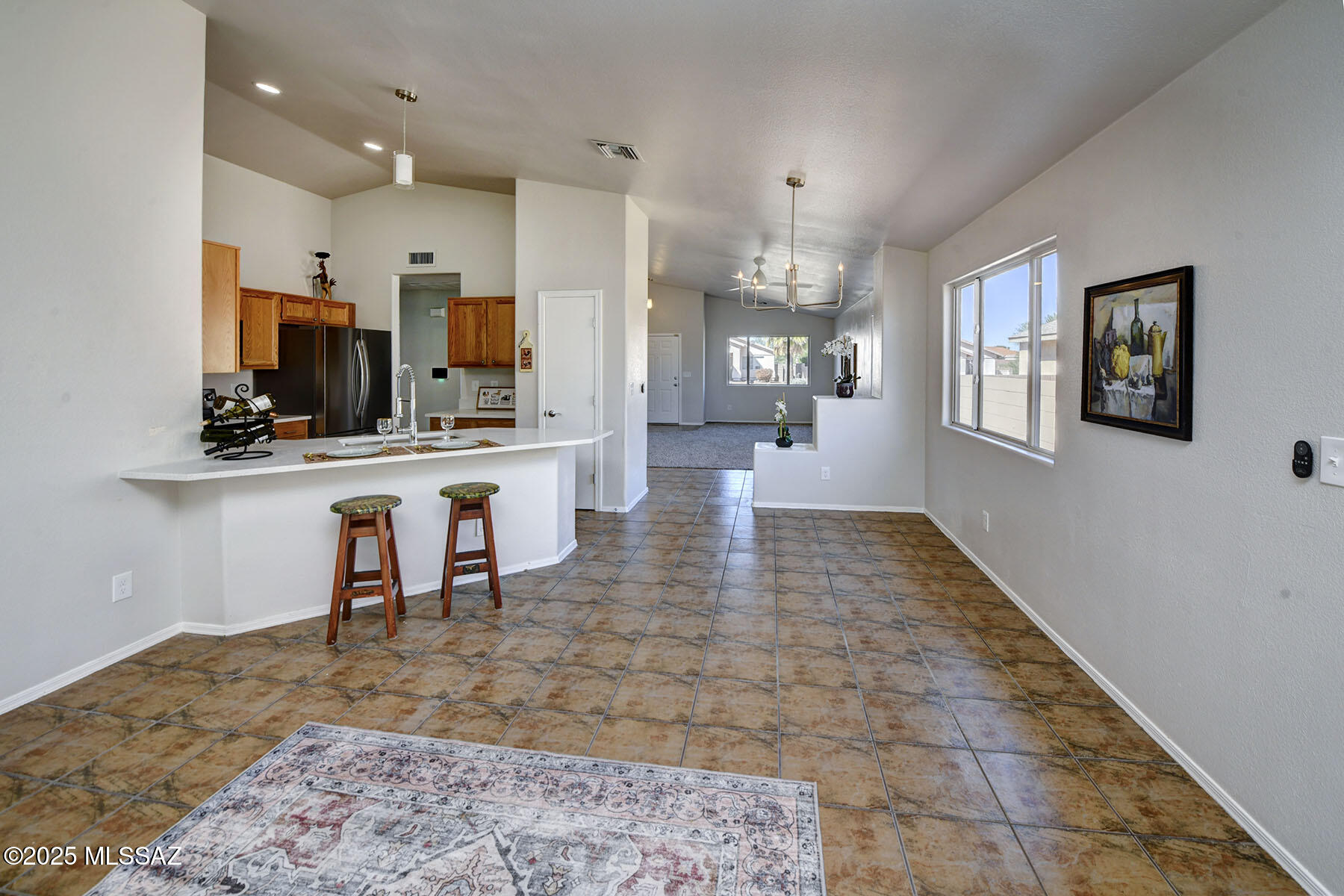 ABSOLUTELY ADORABLE & MOVE-IN READY!  UPDATED & UPGRADED, LIGHT, BRIGHT & CHEERFUL 3 BR/ 2 BA, ALMOST 1500 SQ FT CONTEMPORARY HOME IN A SWEET NEIGHBORHOOD CLOSE TO 1-10, DOWNTOWN & U OF A! THIS SPECIAL HOME BOASTS A TWO CAR GARAGE, SOLAR SYSTEM, HIGH CEILINGS, DUAL PANE WINDOWS, FRESH PAINT THROUGHOUT,  NEW CARPET, REMODELED OPEN CONCEPT KITCHEN W/BREAKFAST BAR, QUARTZ COUNTERTOPS & BRAND-NEW STAINLESS-STEEL APPLIANCES, TOP OF THE LINE CEILING FANS IN ALL ROOMS, NEW LIGHTING & PLUMBING FIXTURES, WALK-IN CLOSET & DOUBLE SINKS IN OWNER'S SUITE, USEFUL SIDE YARD WITH STEPPING STONES PLUS A LOVELY BACK YARD W/ GRASSY AREA, PAVERS & SHADY COVERED PATIO. HOME SITS ON AN ELEVATED LOT AT END OF A QUIET STREET & IS PRICED TO SELL!