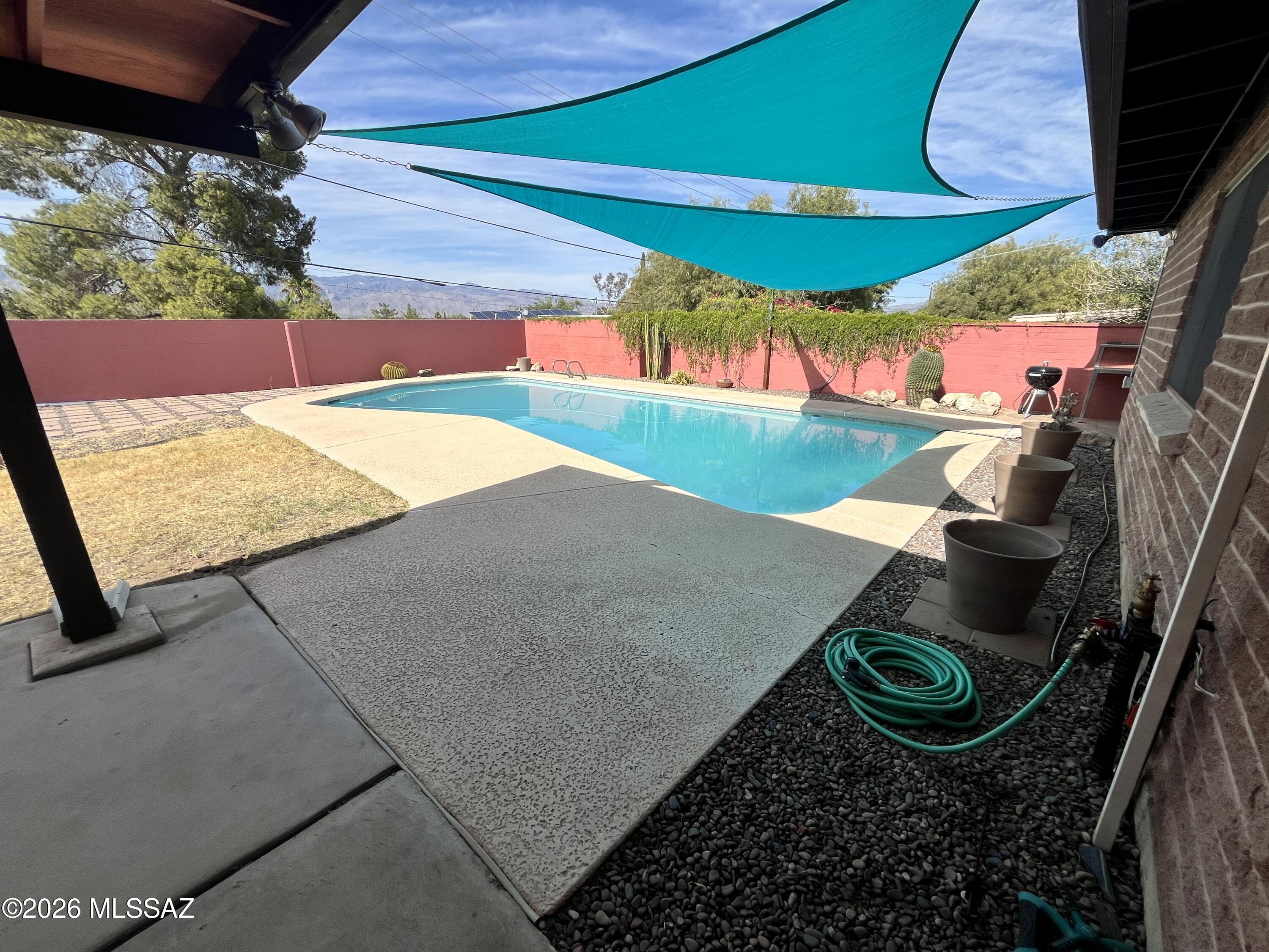 Be the next to enjoy this spacious 3-bedroom, 2-bathroom East Tucson home offering over 2,200 sq. ft. of comfortable living space, a private pool, and solar panels for added energy efficiency. This well-maintained home features a bright, open floor plan with multiple living areas, generous room sizes, and abundant natural light throughout. The large kitchen offers ample cabinet and counter space and opens to the main living areas, making it perfect for everyday living or entertaining. The primary suite includes a private bathroom, while two additional bedrooms provide flexibility for guests, family, or a home office. Enjoy a large backyard with a sparkling pool, and best of all, pool service is included in the rent. Conveniently located near shopping, dining, parks, schools, and more.