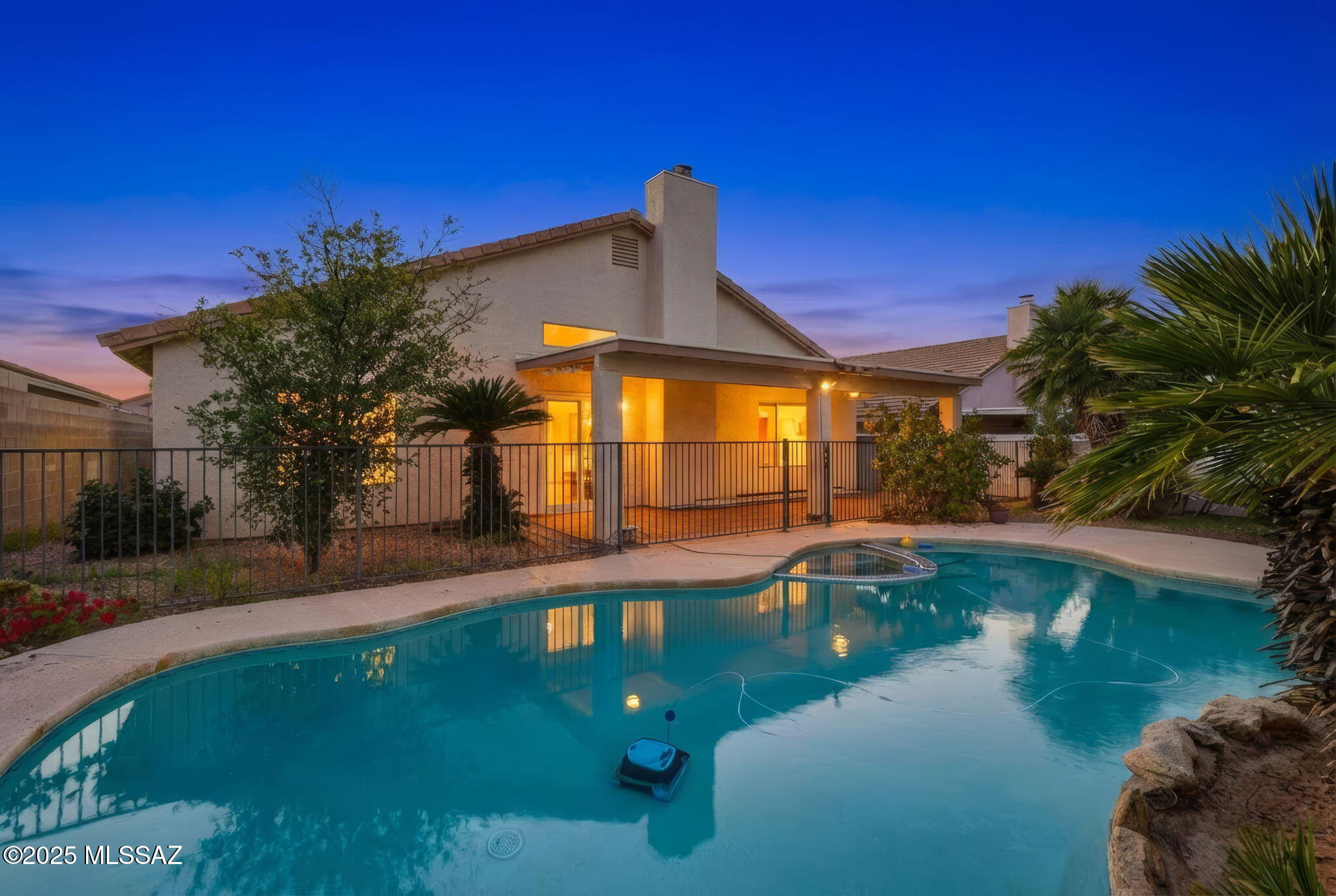 Spacious, single-story East Tucson home featuring a private guest suite (bedroom and family room), sparkling pool, and smart energy-efficient living with solar power. This well-designed floorplan offers high ceilings, abundant natural light, fireplace and a generously sized kitchen with extensive counter space. A true find for buyers seeking comfort, efficiency, and exceptional livability at a great price.