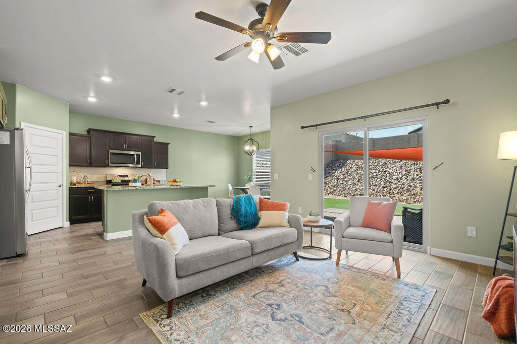Owned solar, a fully landscaped backyard, and upgrades already completed. This 2021-built home offers the benefits of newer construction without the extra out-of-pocket expense.

This beautifully maintained 3-bedroom, 2-bath home offers 1,583 square feet of modern living with a $28,000 solar system that is paid off and fully owned allowing the new owner to enjoy significantly reduced electric costs averaging under $100 per month, a major advantage in Southern Arizona. Located within the highly acclaimed, nationally recognized Vail Unified School District, this home offers both comfort and convenience in one of the area's most sought-after school districts. Outside, enjoy a fully landscaped backyard, a $14,000 improvement already in place, saving you the cost, time and hassle of doing it yourself. Inside, you'll find custom interior paint throughout, upgraded cabinet hardware, a stylish kitchen backsplash, upgraded light fixtures, and ceiling fans in every bedroom and the living room.

Additional functional upgrades include rattlesnake-proofing, upgraded ductwork, an improved irrigation water pump, a secondary water shutoff valve, hanging garage storage, a custom primary bathroom door, and a new garage door.

Why buy brand new and spend thousands more after closing when this home is already finished for you? Move in and enjoy the savings, comfort, and convenience from day one.
