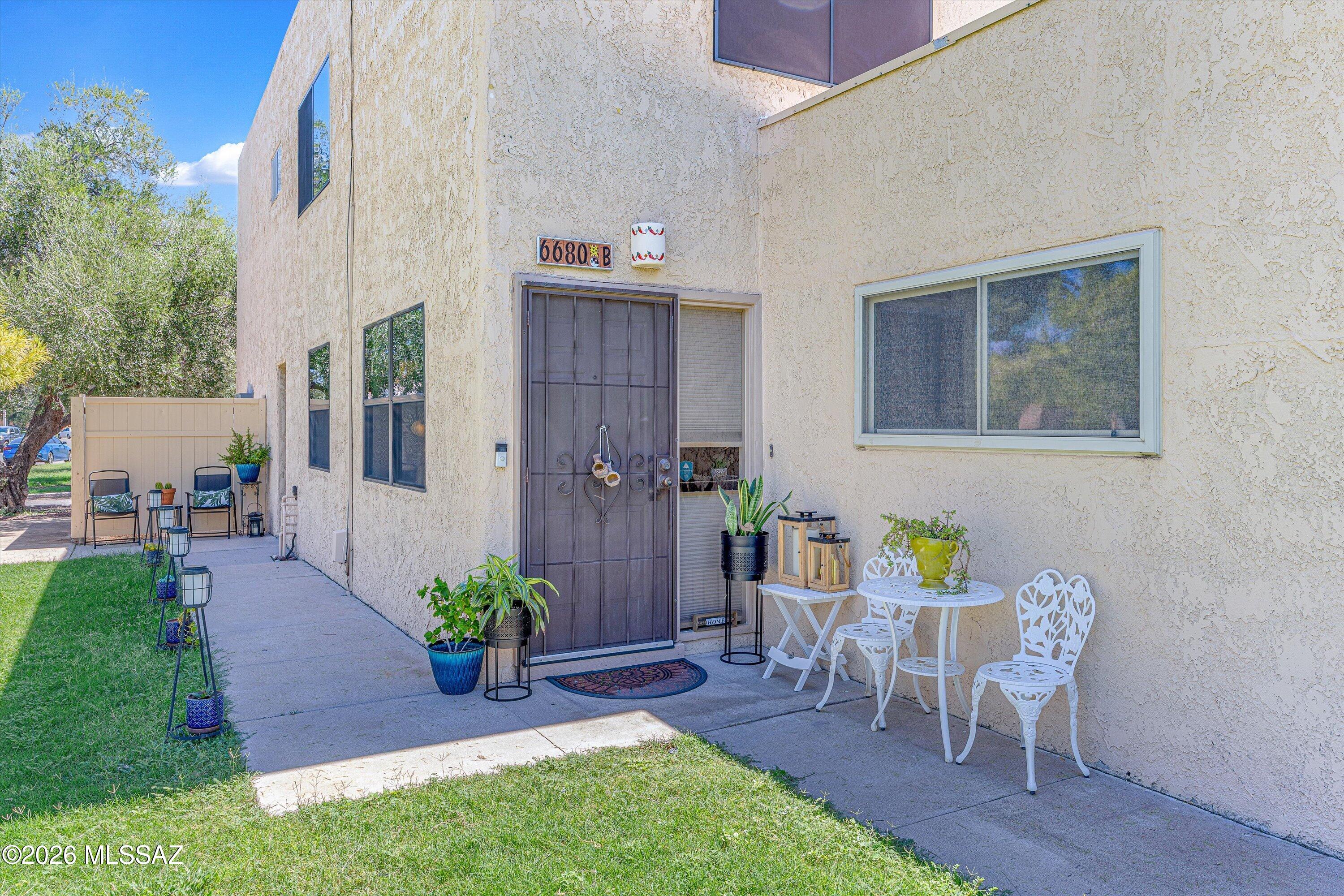 Enjoy breathtaking panoramic views of the Catalina Mountains from this unique and beautifully maintained 2BD/1BA 2-story condo.  This turnkey home would be a great rental or AirBnB property.  With a ground floor entry, freshly painted interior brightens the home inviting the natural light to come through the north-facing dual-pane windows. This open layout features an updated kitchen with granite countertops, modern appliances, a breakfast bar with seating area, tile flooring in the main living areas, and warm wood laminate flooring in both bedrooms. One bedroom offers a captivating view of Mt Lemmon, making it a beautiful space to wake up to or use as a home office.  Bathroom upgrades include tile shower and large vanity mirror cabinet with deocrative towel rack. Storage areas in carport. The 1-Car Carport has 3 large lockable storage cabinets with room for your bikes & more.  A mature pine tree right outside attracts native birds, offering remarkable birdwatching from both upstairs and downstairs windows. The Meadows is a peaceful, park-like, pet-friendly community with mature trees and green belts, two sparkling community pools, covered parking, and convenient on-site laundry. Located just minutes from Udall Park, the Loop bike path, shopping, restaurants, and daily conveniences. HOA covers roof, water & sewer, trash collection, exterior and yard maintence plus blanket insurance. This is a prime east Tucson location that offers a rare combination of comfort and tranquility.