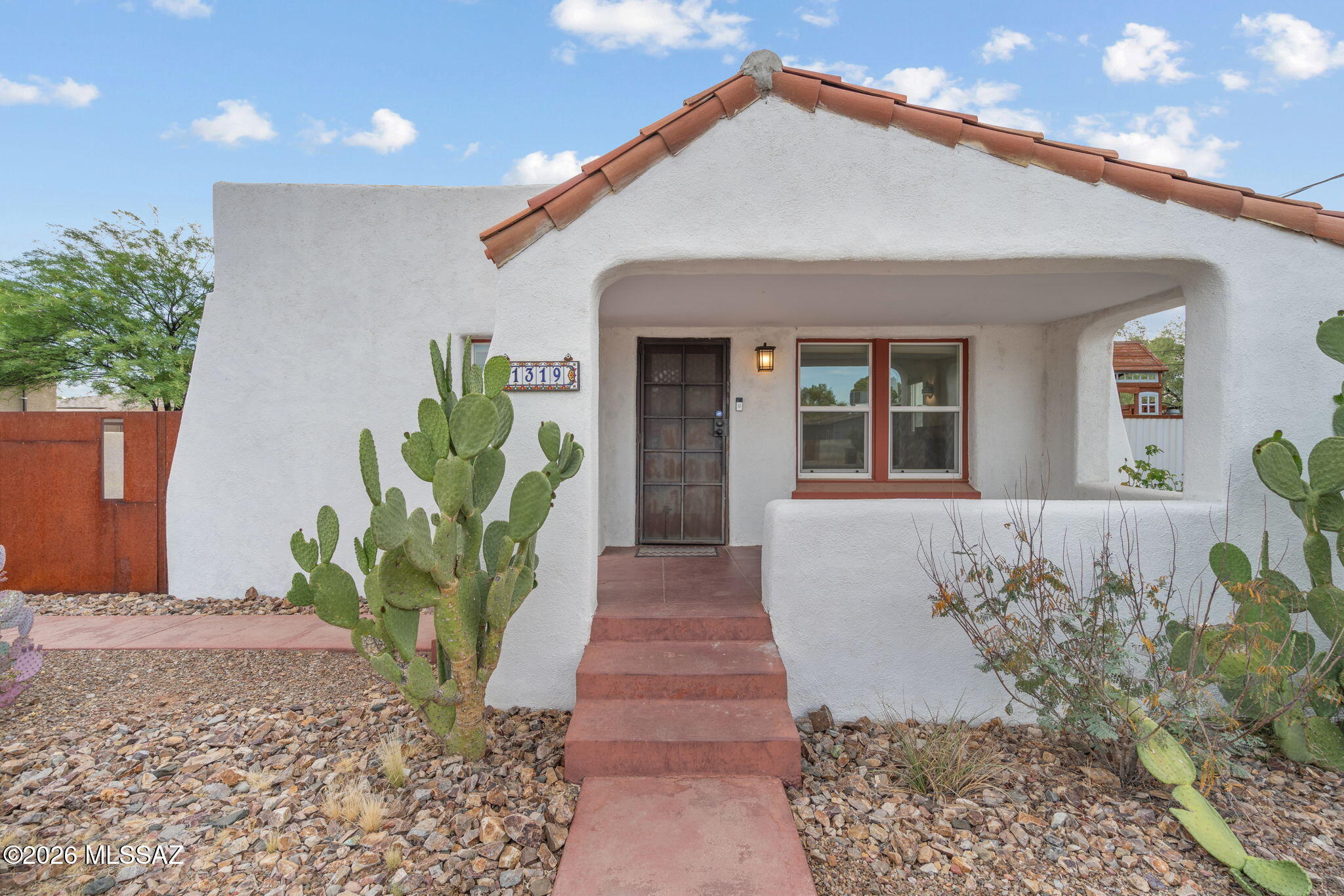 Midtown Tucson charm with bonus features! This character-filled bungalow offers wood floors, coved ceilings, archways, and an updated kitchen with granite counters and stainless appliances. A standout feature is the detached casita with bathroom & separate laundry hookups, ideal for guests, a home office, flex space, or potential rental income. Another bonus is the 320sqft basement that can be utilized for valuable storage space. Additional updates include double pane windows, HVAC, electrical panel, playset all sitting on an oversized lot, in a prime central Tucson location that is just around the corner from Whole Foods, Coffee Times, and on the planned Miramonte-Palo Verde bike boulevard. Minutes from UofA, Banner University Medical Center, and downtown Tucson.