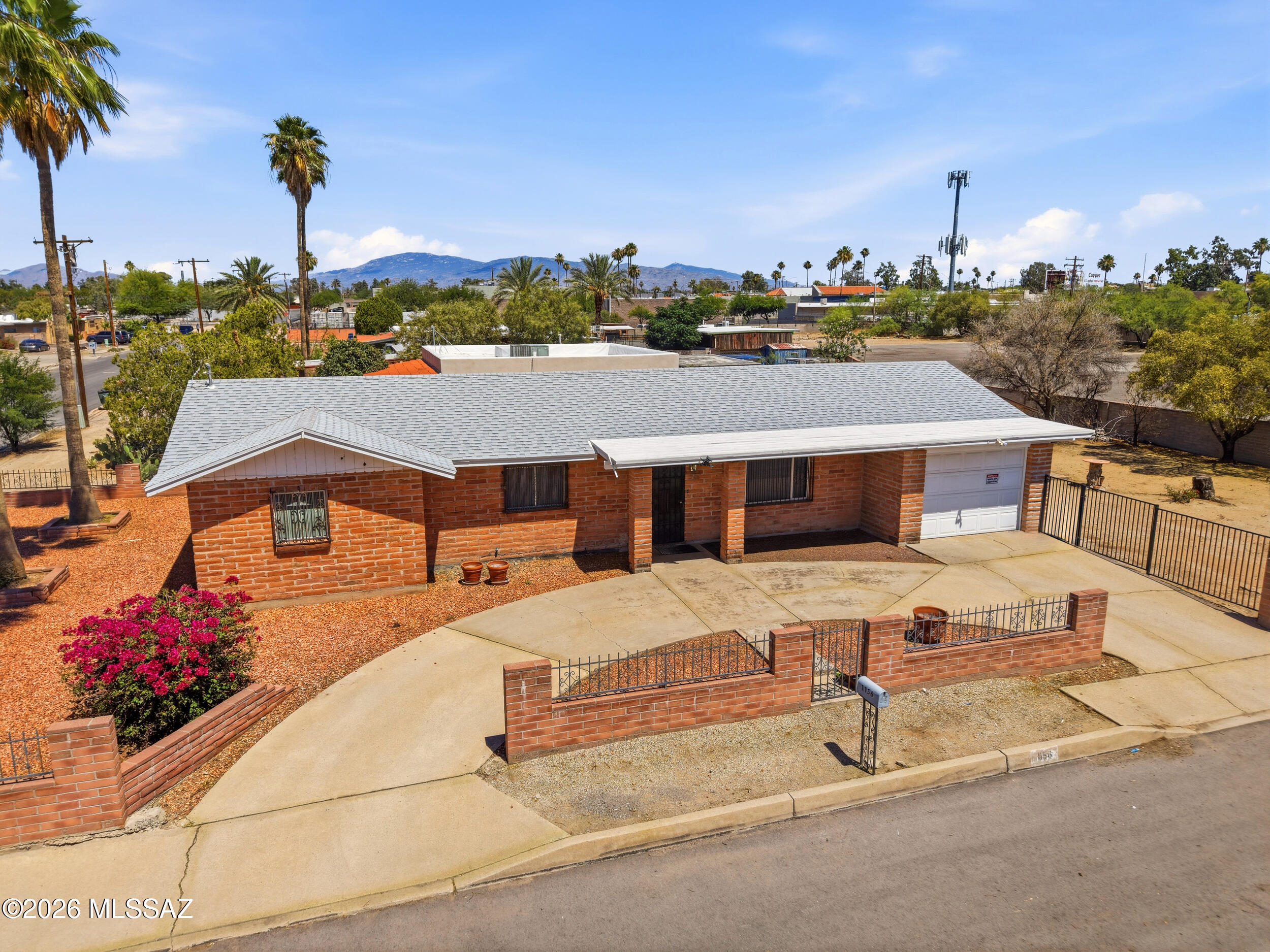 Charming Central Tucson brick home on a spacious corner lot! This 3 bed, 2 bath property offers timeless character, functional living space, and incredible potential for future expansion. The oversized lot provides plenty of room for multiple casitas, workshop, garden, or RV parking -- a rare opportunity in this desirable location. Enjoy easy access to local dining, shopping, parks, and the U of A while still having the privacy and flexibility of a large homesite. Whether you're looking for a primary residence, investment opportunity, or multigenerational setup, this property is packed with possibilities.