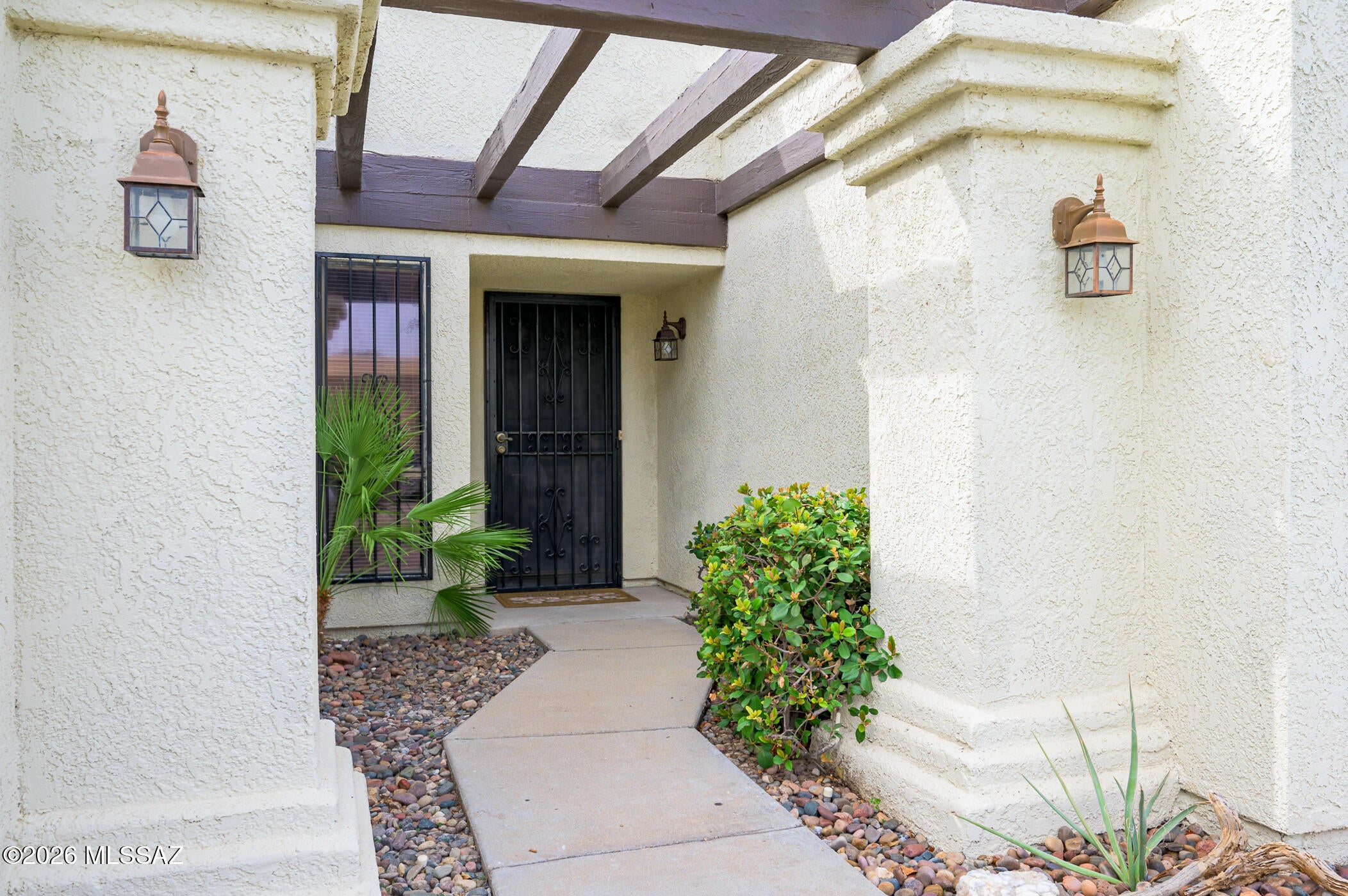 Welcome home! This beautifully maintained 2 bedroom, 2 bathroom townhome in the desirable Golden Heritage Village offers a light filled interior, comfortable living spaces, and thoughtful features throughout. As you step inside you will notice the natural light and open layout. The kitchen offers plenty of cabinet space and flows seamlessly into the family room. The fireplace is a stunning focal point that centers the room. A full size washer and dryer are conveniently located inside the home. The primary suite features a soaking tub, separate walk in shower, dual sinks, and a walk in closet. The additional bedroom has two giant closets and is nearby a second full bathroom. Enjoy the ease of low maintenance living with a private backyard and outdoor storage room. A 2 car garage provides additional convenience and storage. Residents of Golden Heritage Village enjoy wonderful community amenities including a tennis/pickleball court, pool, and hot tub. Conveniently located just minutes from Target, Trader Joe's, and a variety of other shopping and dining options. This home makes everyday errands and dining out easy and accessible. With its inviting interior, low maintenance outdoor space, and exceptional community amenities, this townhome is ready to welcome you home.