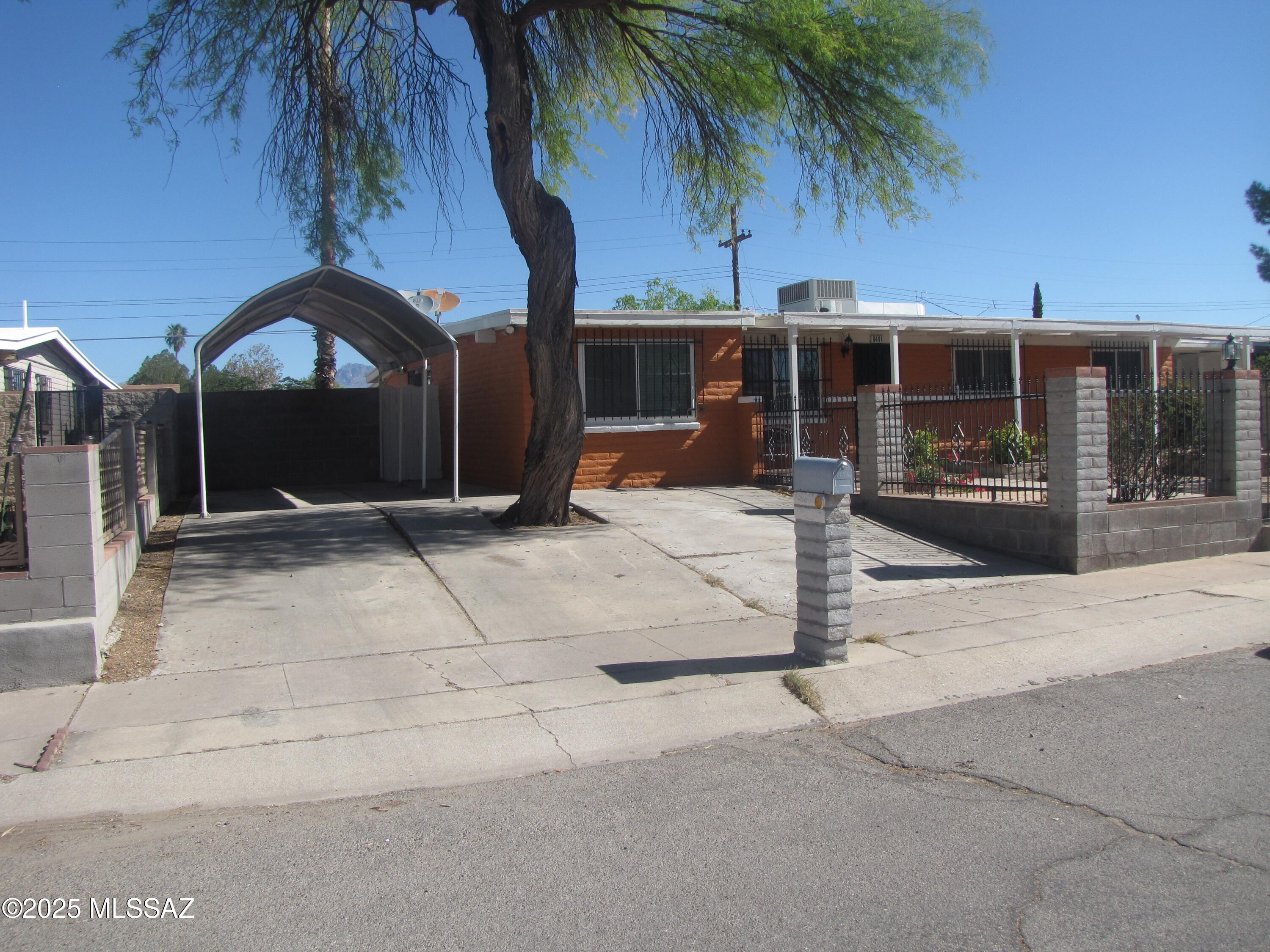 This 4 bedroom, 2 bath home with no HOA has been meticulously & lovingly maintained by the owners.  Newer A/C & hot water heater, dual pane windows, ceiling fans, master bathroom shower updated.  1911 sq. ft floor plus den home with solid slump block construction, new interior paint, huge master bedroom with 2 closets, sunken family room, wrought iron security on all doors & windows.  Close to Lakeside park, schools & busline.  Convenient to DMAFB, Pima Community College East & shopping.  Car canopies cover will stay.  Seller is ready for a quick close.