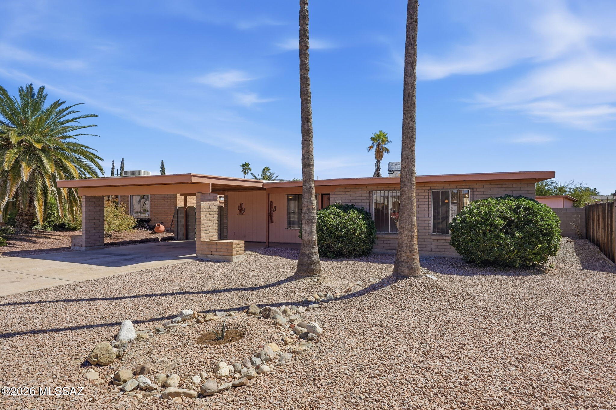 Splash into summer with a sparkling pool! Step into a terrific floorplan featuring living room, dining area and family room off kitchen! Easy care ceramic tile throughout and cool down with 6 ceiling fans! Step out to the covered patio overlooking pool and  spacious yard! Quiet neighborhood close to shopping and restaurants! Oversized 12x20 workshop to convey as is.