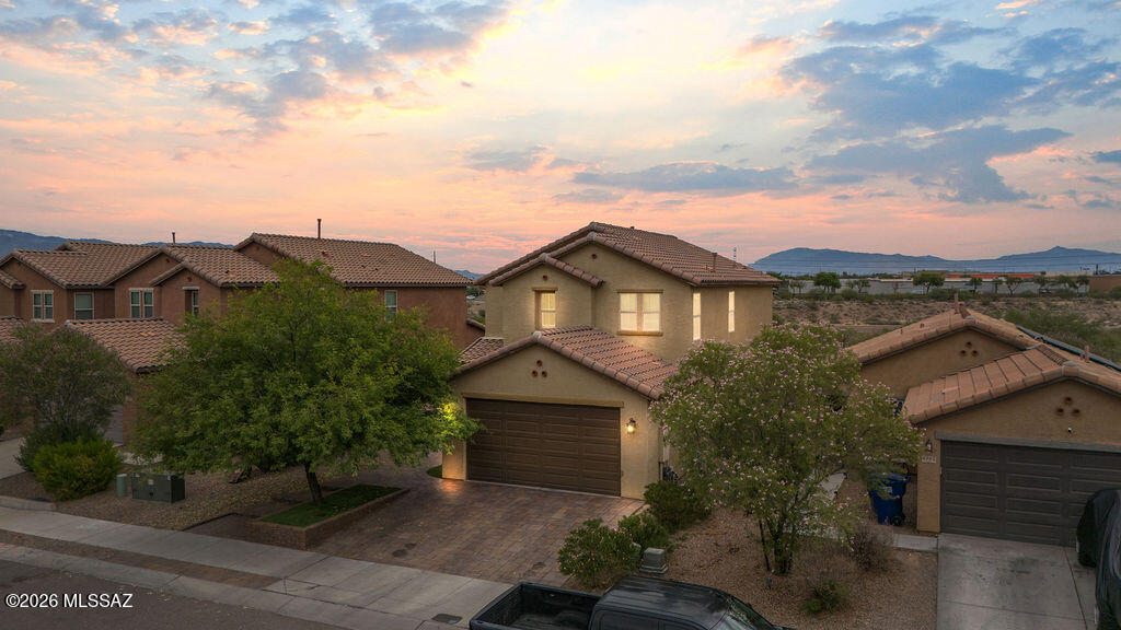 Beautifully updated 4 bedroom and 3 FULL bathroom 2 story with no rear neighbors and walking distance to the Tucson Spectrum shopping center. There is also a second living room space upstairs that could be used as a kids play area, movie room or office. Down stairs there are 9 foot ceilings which provide a spacious, open feeling. There is a trail in between the property and the home to the north which provides direct access to The Loop recreational trail. The property has an east facing backyard that borders the Santa Cruz river so shade, beautiful sunsets and privacy are all desirable characteristics you will get to enjoy. The interior has new paint, new carpet and don't forget to check out the spectacular remodeled kitchen. Enjoy the fully landscaped backyard with mountain views. Also make sure you check out the proximity of this address to all the amazing shopping and restaurants that are just a short walk away. Movie theaters, grocery stores, home improvement stores and access to Interstate 19 are less than 2 minutes away. Homes that are this meticulously maintained are not common. Schedule a showing, you will not be disappointed!