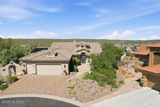 One of a kind residence with panoramic views, resort style backyard with salt water pool and exceptional craftsmanship.

Discover an extraordinary 3BR, 3BA plus library and office residence situated on an oversized lot in a peaceful cul-de-sac and believed to occupy one of the highest elevations within the community. From this exceptional vantage point, sweeping panoramic views extend for miles, creating a breathtaking backdrop and an unparalleled sense of space, privacy, and tranquility.

Meticulously maintained and showcasing an unmistakable pride of ownership, this immaculate home offers a rare combination of thoughtful upgrades, timeless craftsmanship, and exceptional outdoor living. The home is truly move-in ready, including a NEW ROOF for added peace of mind. One of a kind residence with panoramic views, resort style backyard with Salt water pool and exceptional craftsmanship.

Discover an extraordinary 3BR, 3BA plus library and office residence situated on an oversized lot in a peaceful cul-de-sac and believed to occupy one of the highest elevations within the community. From this exceptional vantage point, sweeping panoramic views extend for miles, creating a breathtaking backdrop and an unparalleled sense of space, privacy, and tranquility.

Meticulously maintained and showcasing an unmistakable pride of ownership, this immaculate home offers a rare combination of thoughtful upgrades, timeless craftsmanship, and exceptional outdoor living. The home is truly move-in ready, including a NEW ROOF for added peace of mind.

The library features custom-built oak bookcases, along with abundant storage throughout the home.

The heart of this remarkable property is the spectacular backyard, designed for both elegant entertaining and peaceful relaxation. A gorgeous saltwater pool with newer equipment is complimented by an elevated spa featuring a dramatic natural rock waterfall, creating a tranquil resort-like atmosphere. The outdoor living experience continues with a built-in barbecue, beehive gas fireplace, putting and chipping green, making this an entertainer's dream and an ideal setting for enjoying Arizona's beautiful outdoor lifestyle.

Extensive upgraded landscaping enhances the property with mature vegetation.

A built-in sauna off the guest room provides a wonderful private wellness retreat. Architectural details throughout have been thoughtfully enhanced to complement the home including updated squared columns that create clean contemporary lines. 

This is far more than a home-it is a distinctive lifestyle property offering spectacular views, exceptional craftsmanship, resort-style amenities, abundant entertaining spaces, and the serenity of a quiet cul-de-sac setting. 

Ample space available to add on a casita if desired.

A truly rare offering for the discerning buyer seeking something beyond the ordinary.