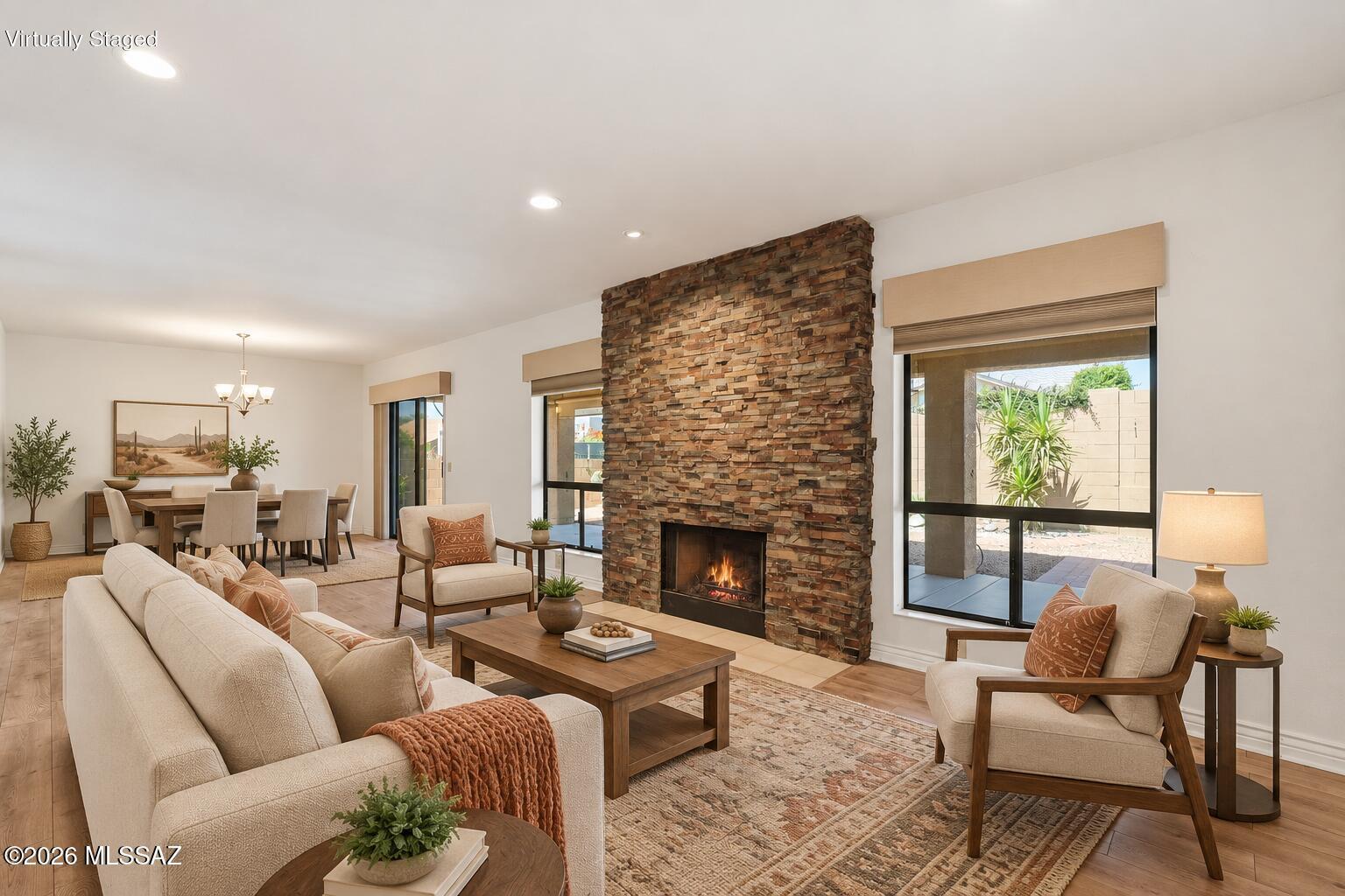 Move-in ready and beautifully updated, this 3BD/2BA Alameda model offers exceptional value in SaddleBrooke! The light-filled, open floor plan is designed for comfortable living and effortless entertaining, featuring a stylish quartz kitchen, matching wet bar and inviting gas fireplace. Tastefully updated bathrooms add a fresh, modern touch. Major improvements include roof underlayment completed (2026), exterior paint (2024), updated irrigation and solar screens for added energy efficiency. Additional features include ceiling fans in all bedrooms, a recirculating hot-water pump and hot tub hookup. Enjoy Arizona living in the private backyard with two citrus trees and a dedicated garden area. A standout home with the updates today's buyers want!