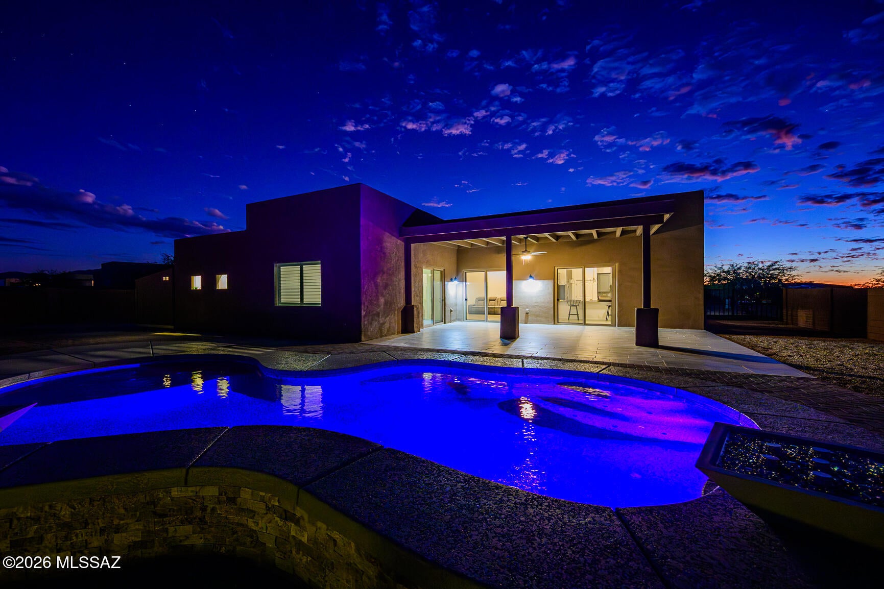 This one fills all the squares!  Vail School District!  SALTWATER POOL!  This single level 2154 SF home features 4 beds/2 baths!  Wood look tile throughout!  NO CARPET!  Great Room Concept!  Split Floor plan for added privacy!   12-foot ceilings!  Chef's dream kitchen featuring custom granite counters, double ovens, prep island and stainless appliances! HUGE primary bedroom boasts walk-in closet, primary bath features dual sinks, large walk-in shower/Jacuzzi Tub!  Whole house water filtration/RO! FIBER OPTIC INTERNET!  If that's not enough step outside into your own private backyard oasis with tiled patio, pebble tech pool with baja deck, custom lighting and waterfall!  Amazing mountain and sunset views!  RV GATE! 3 Car Garage w/epoxy floors. Custom tuff shed! Schedule your showing today!