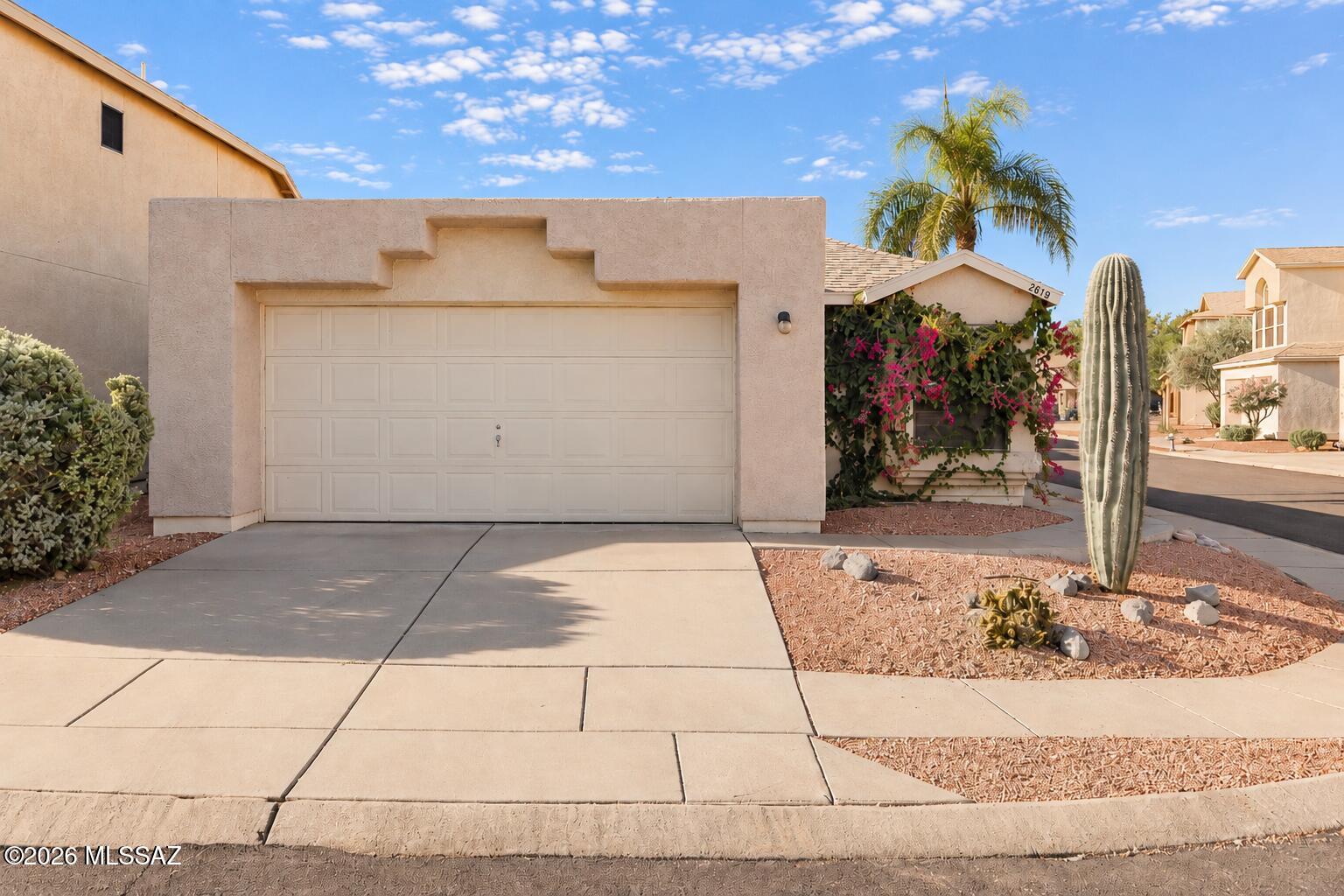 Welcome home to this charming 2-bedroom, 2-bath residence nestled on a quiet cul-de-sac! Offering 1,069 square feet of thoughtfully designed living space with a desirable split-bedroom floor plan, this home combines comfort, convenience, and exceptional value. The big-ticket improvements have already been taken care of! Enjoy peace of mind with a newer roof, HVAC system, water heater, and replaced plumbing, along with recent updates including beautiful luxury vinyl plank flooring throughout, fresh interior paint, new kitchen appliances, and a freshly refinished and painted garage. With no carpet to maintain, a cozy wood-burning fireplace, and a private, low-maintenance backyard, this home is truly move-in ready. The kitchen and bathrooms offer a clean, functional foundation with the opportunity to personalize and update at your own pace. Conveniently located with easy access to I-10, the University of Arizona, Banner and St. Mary's hospitals, Pima Community College, and other major employment centers. Low HOA fees add to the appeal! Whether you're purchasing your first home, downsizing, or looking for an investment property, this home offers the perfect combination of practical upgrades, affordability, and potential. Move right in and make it your own!