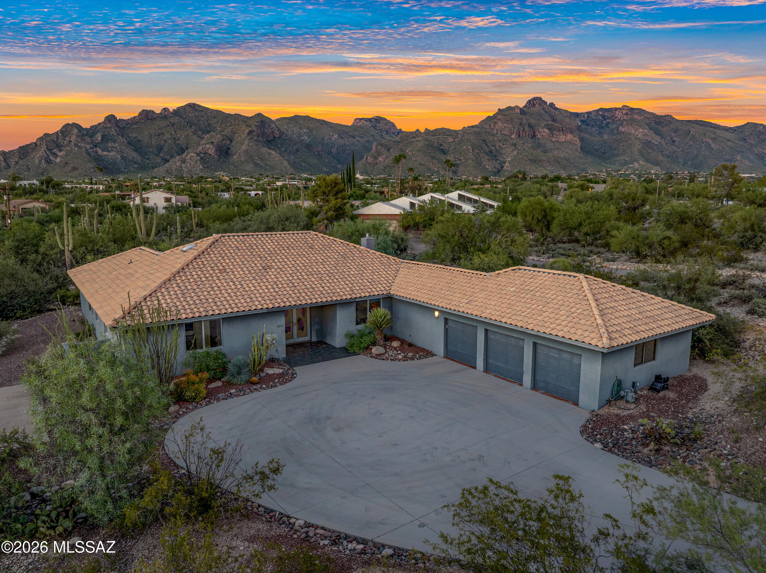 Bold modern style meets breathtaking views in this completely reimagined Santa Catalina Estates gem! Stunning double-door entry opens to an expansive great room w/soaring vaulted ceilings, dramatic metal-clad FP & an open-concept design made for effortless living & entertaining. Spacious kitchen impresses w/quartz counters, SS appliances, double ovens, gas cooktop & oversized island w/vibrant contemporary flair. Generous primary offers dual vanities, a large walk-in shower & a versatile sitting area ideal for a home office. Outside enjoy a private backyard retreat featuring a beautiful PebbleTec pool, large covered patio & spectacular mountain vistas & sunset views. Masonry construction, Italian tile flooring & oversized three-car garage complete this exceptional Foothills home.